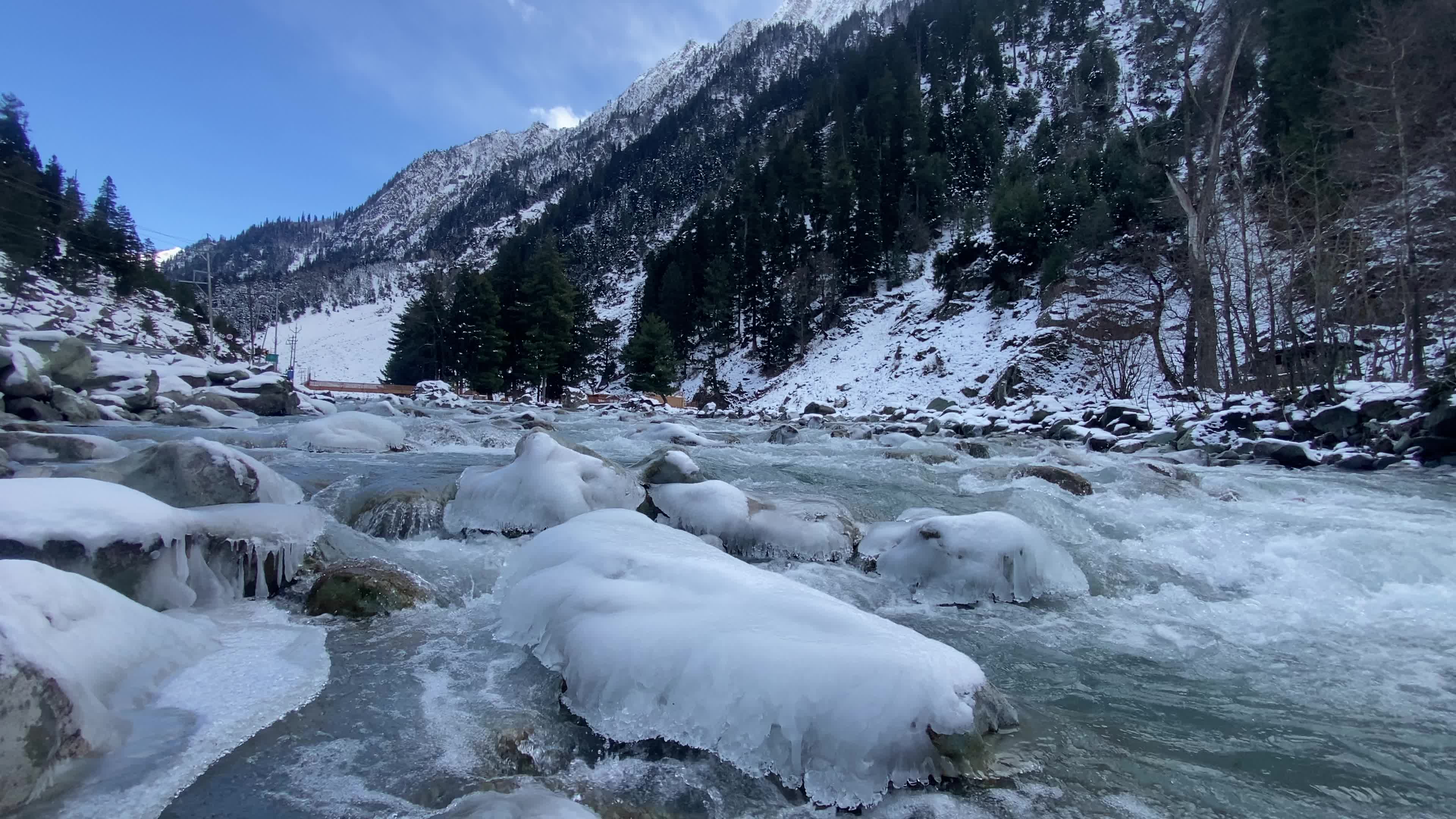 A view of partially frozen river sindh during winter.