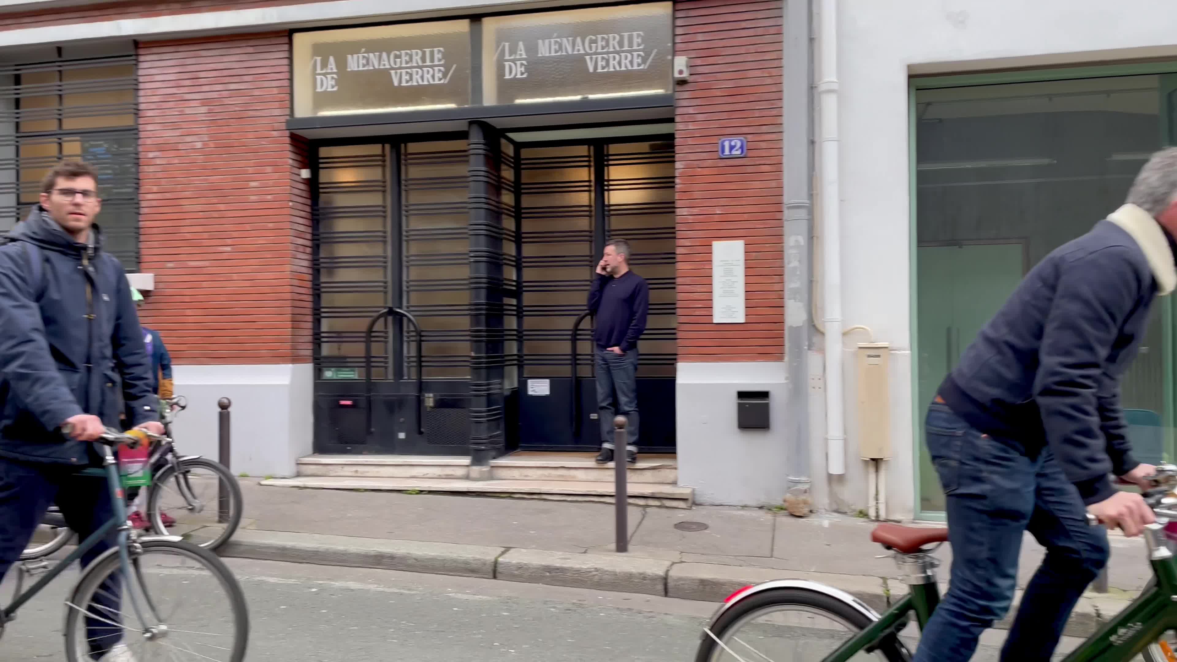 Emmanuel Grégoire on a bicycle in the streets of Paris