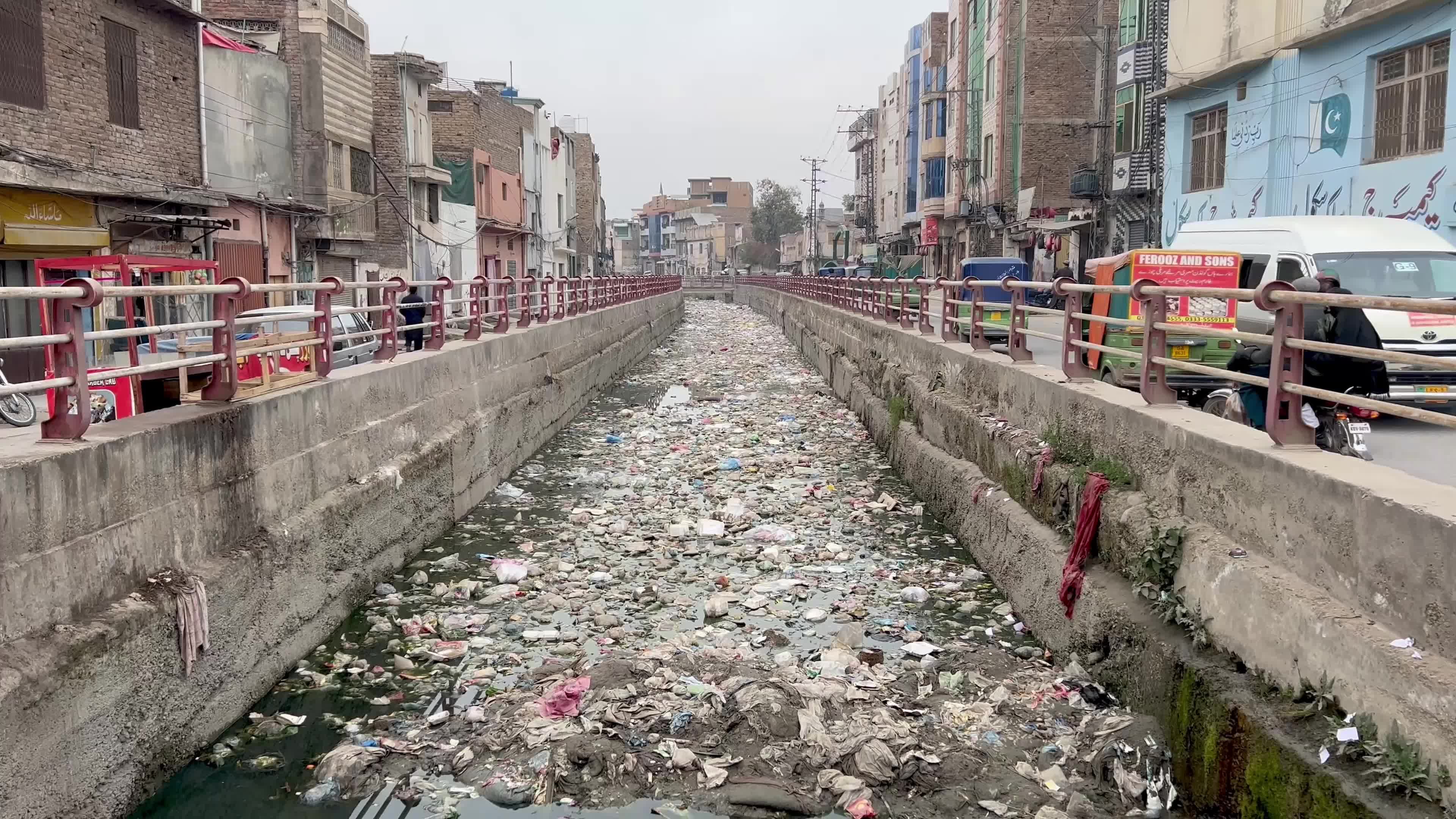 Garbage clogs canal in Peshawar 