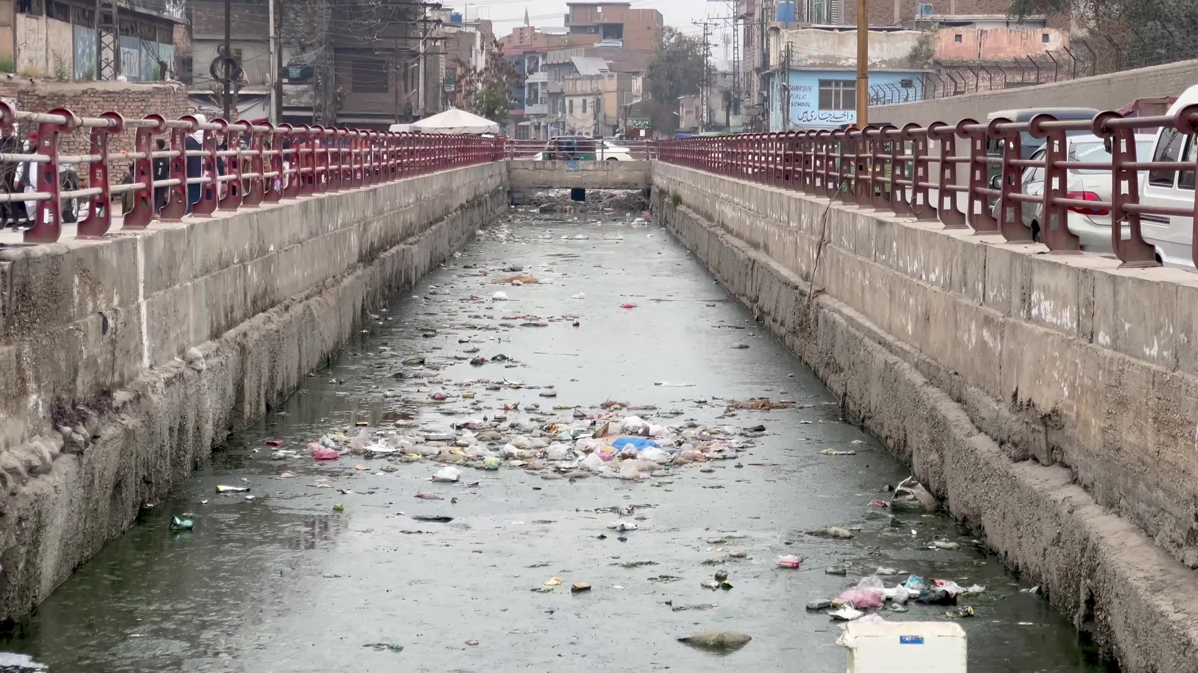 Garbage clogs canal in Peshawar 