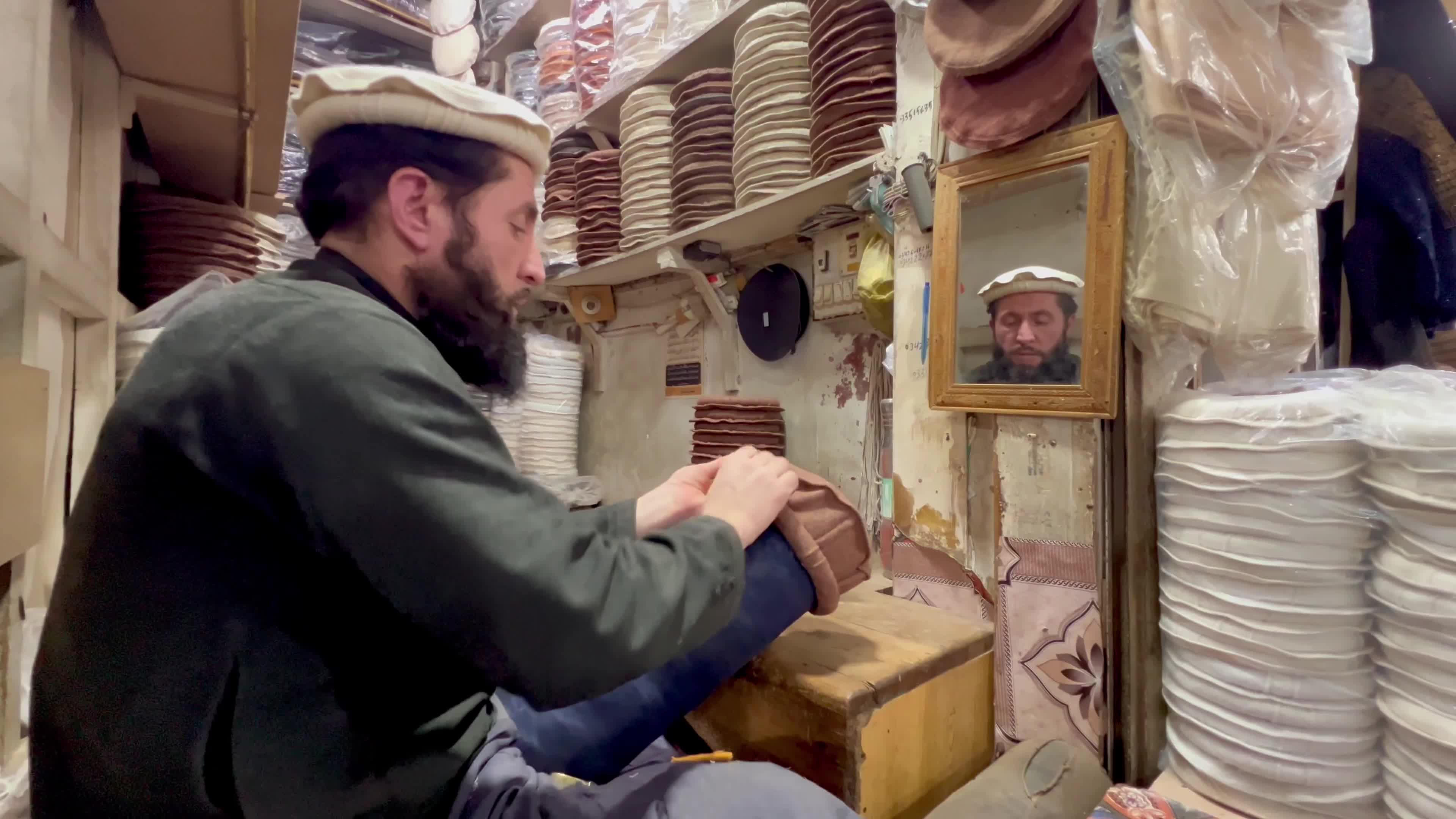 Pakistanis wear Chitrali caps amid cold winter weather