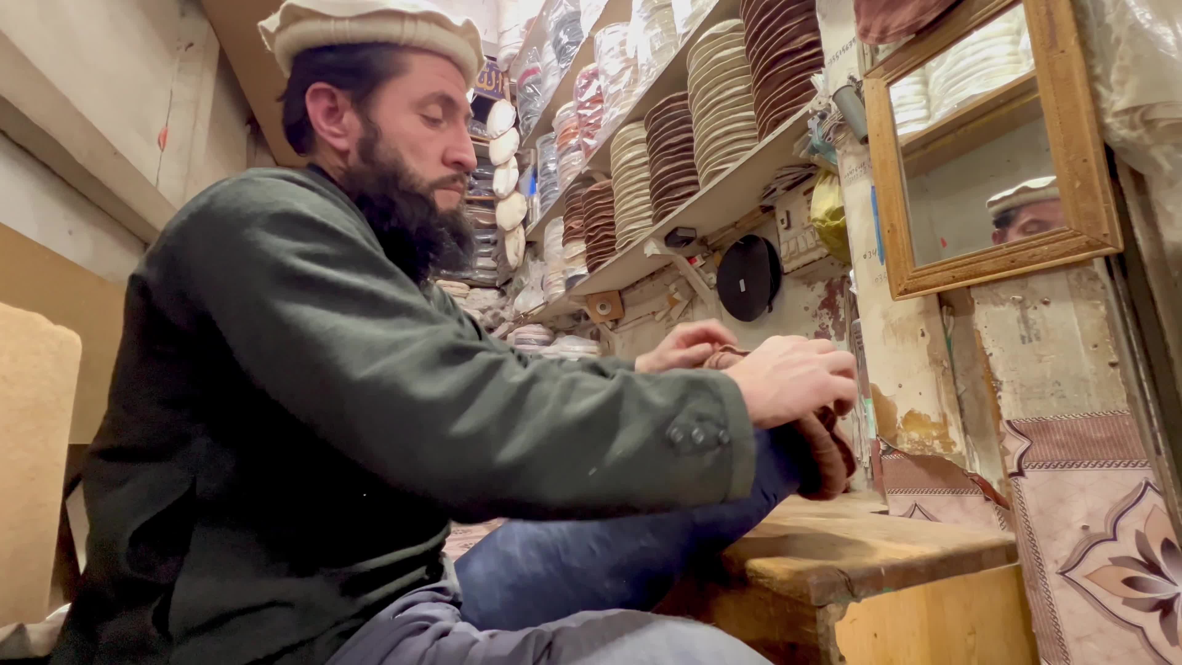 Pakistanis wear Chitrali caps amid cold winter weather