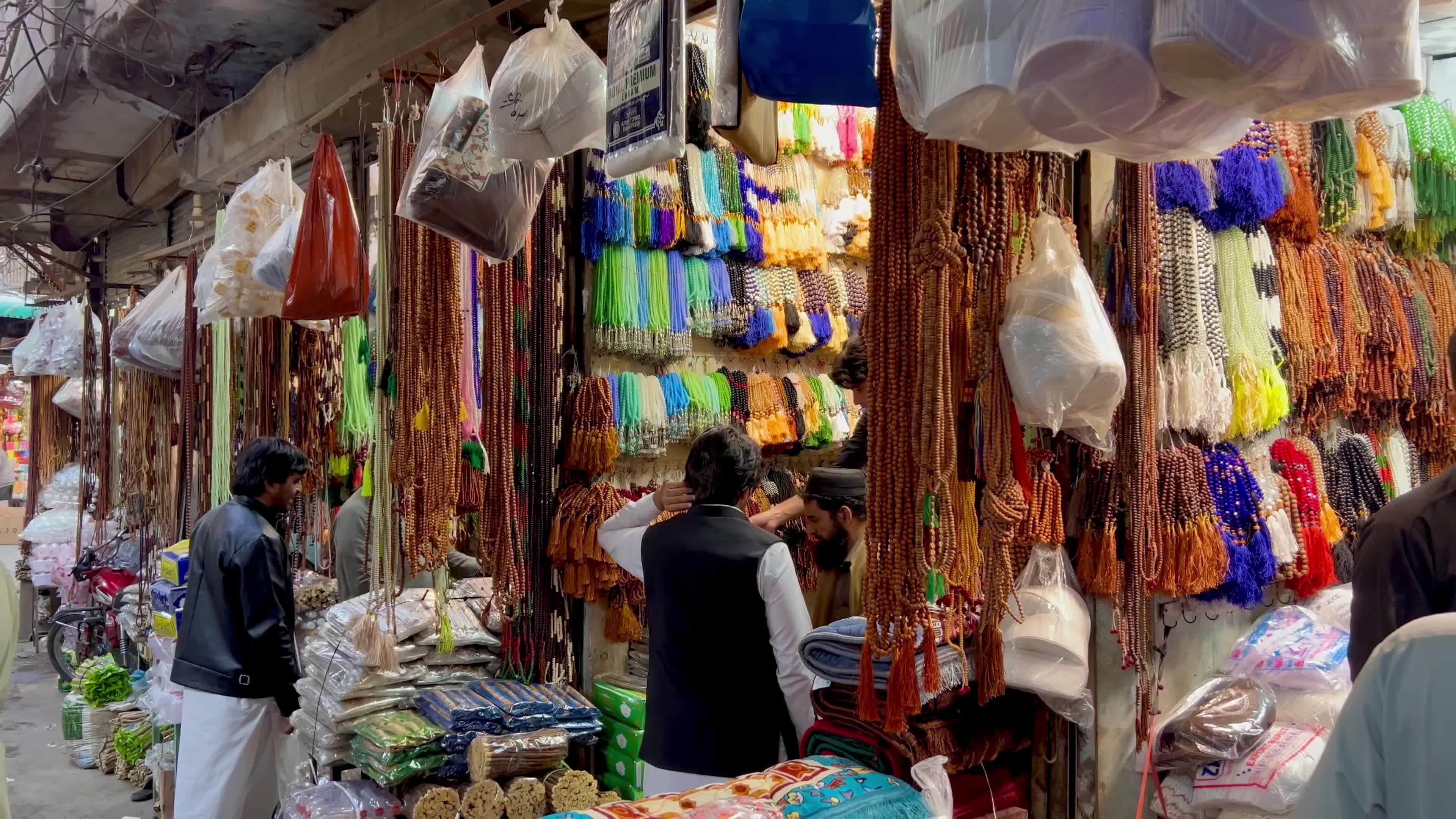 Prayer caps and beads on sale ahead of Ramadan in Peshawar