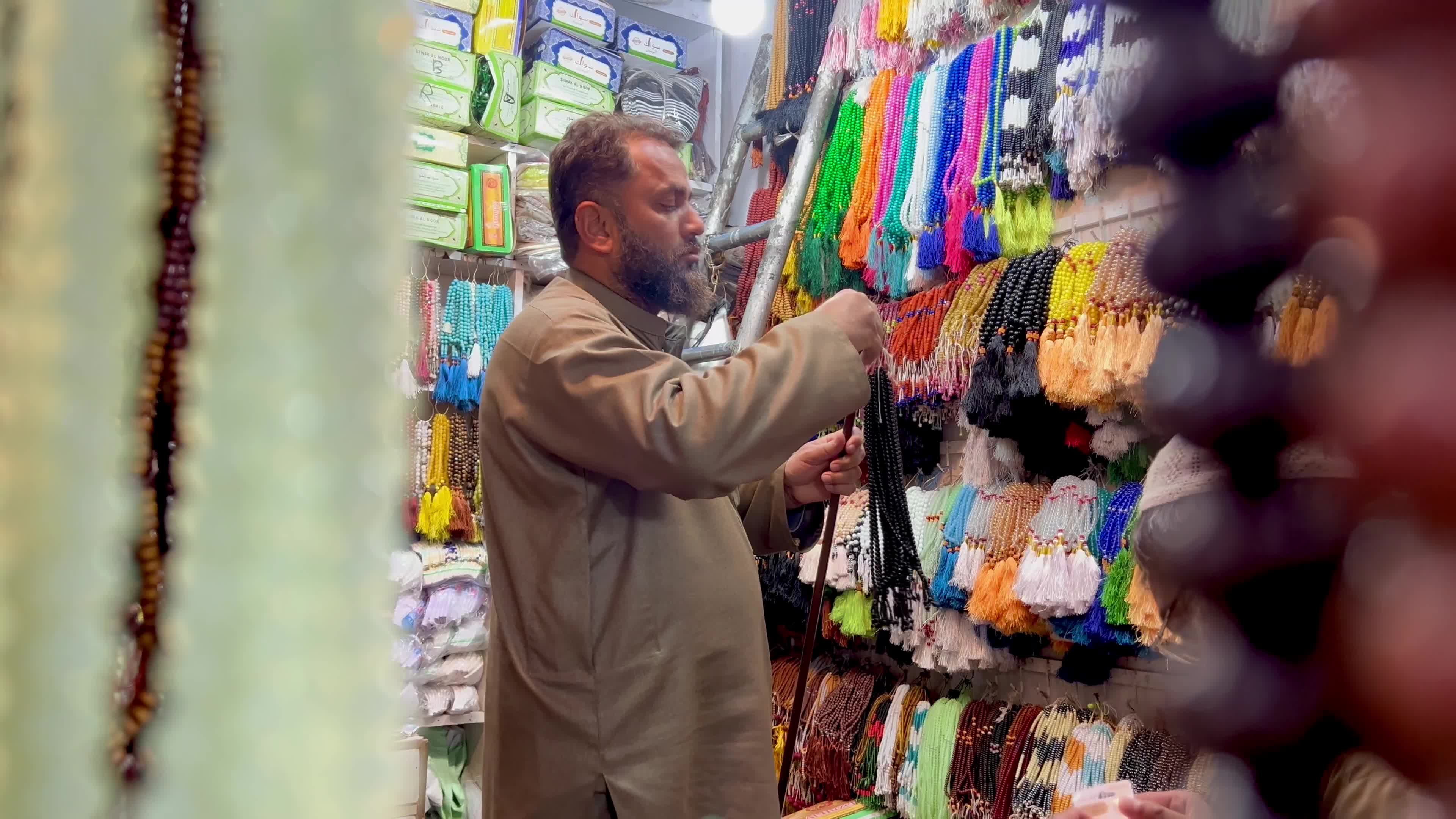 Prayer caps and beads on sale ahead of Ramadan in Peshawar