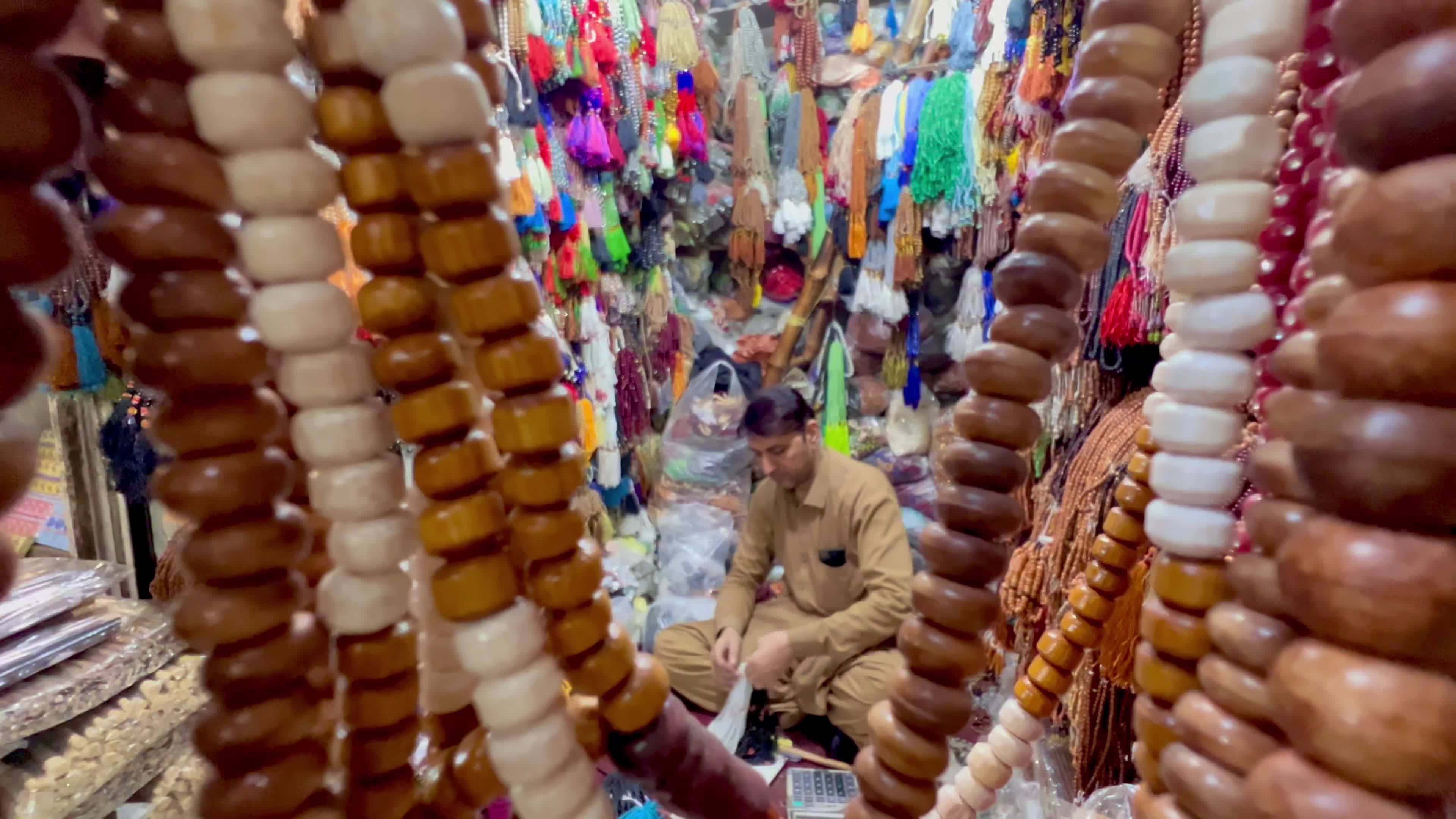Prayer caps and beads on sale ahead of Ramadan in Peshawar