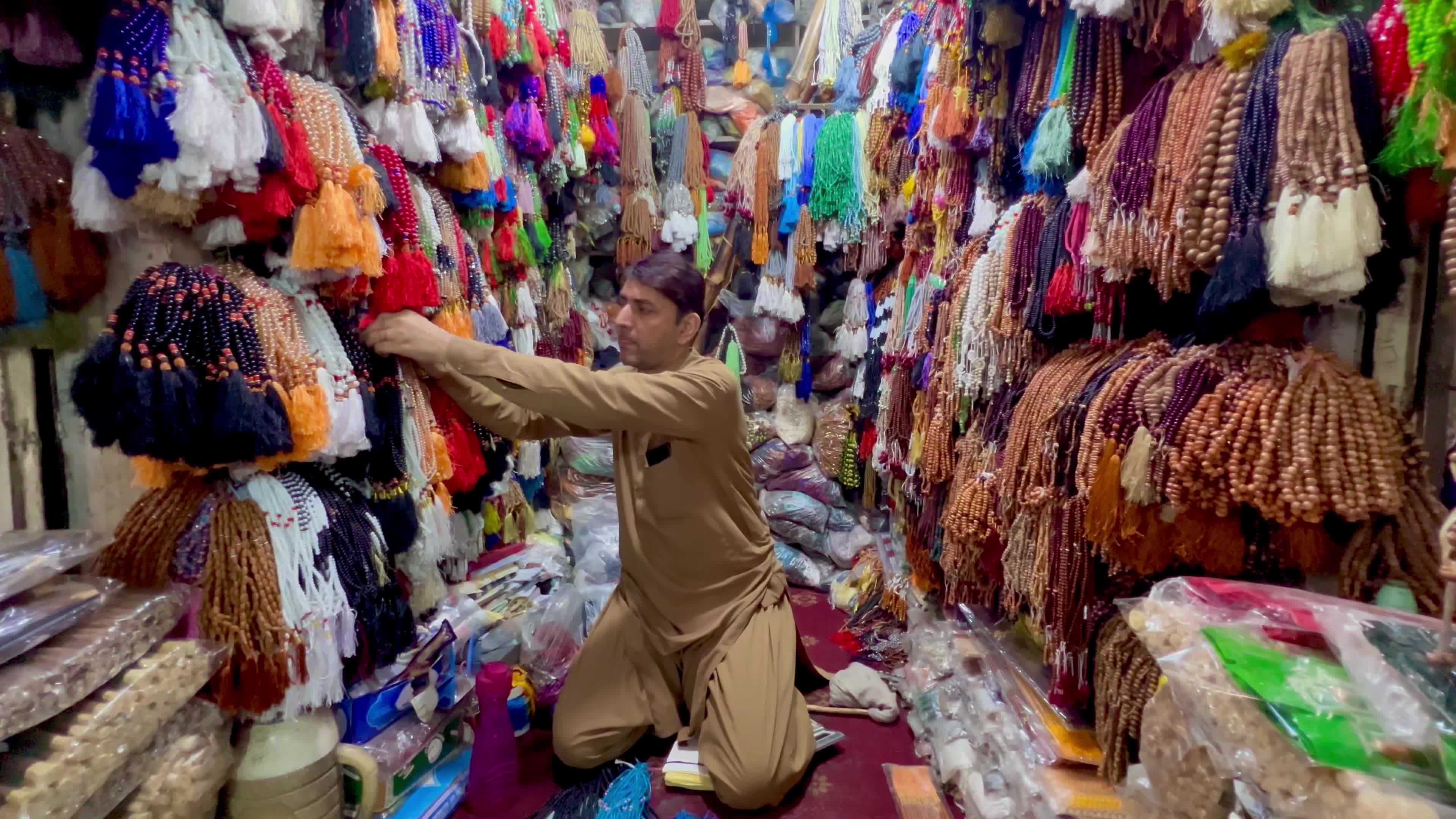 Prayer caps and beads on sale ahead of Ramadan in Peshawar