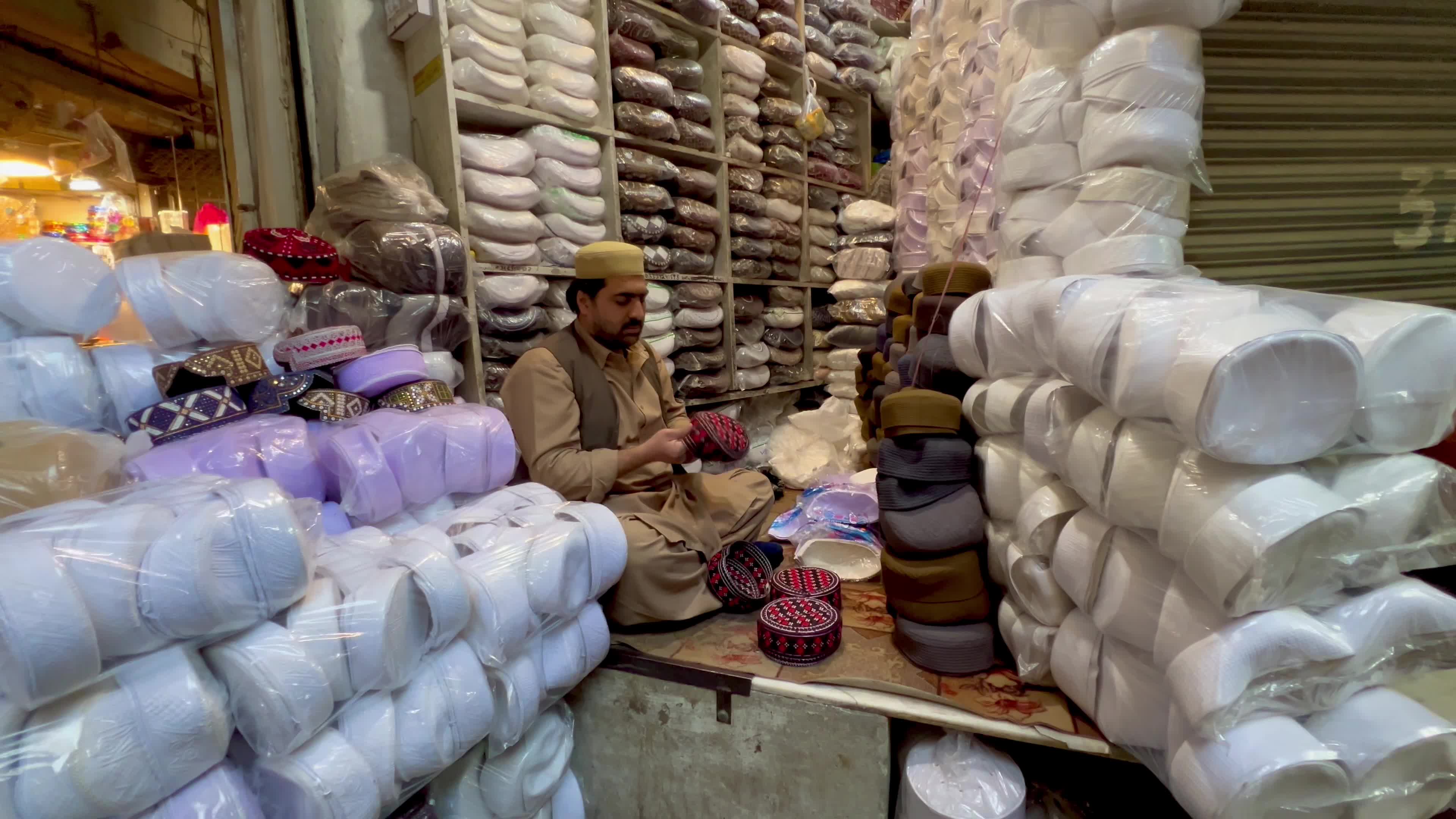 Prayer caps and beads on sale ahead of Ramadan in Peshawar