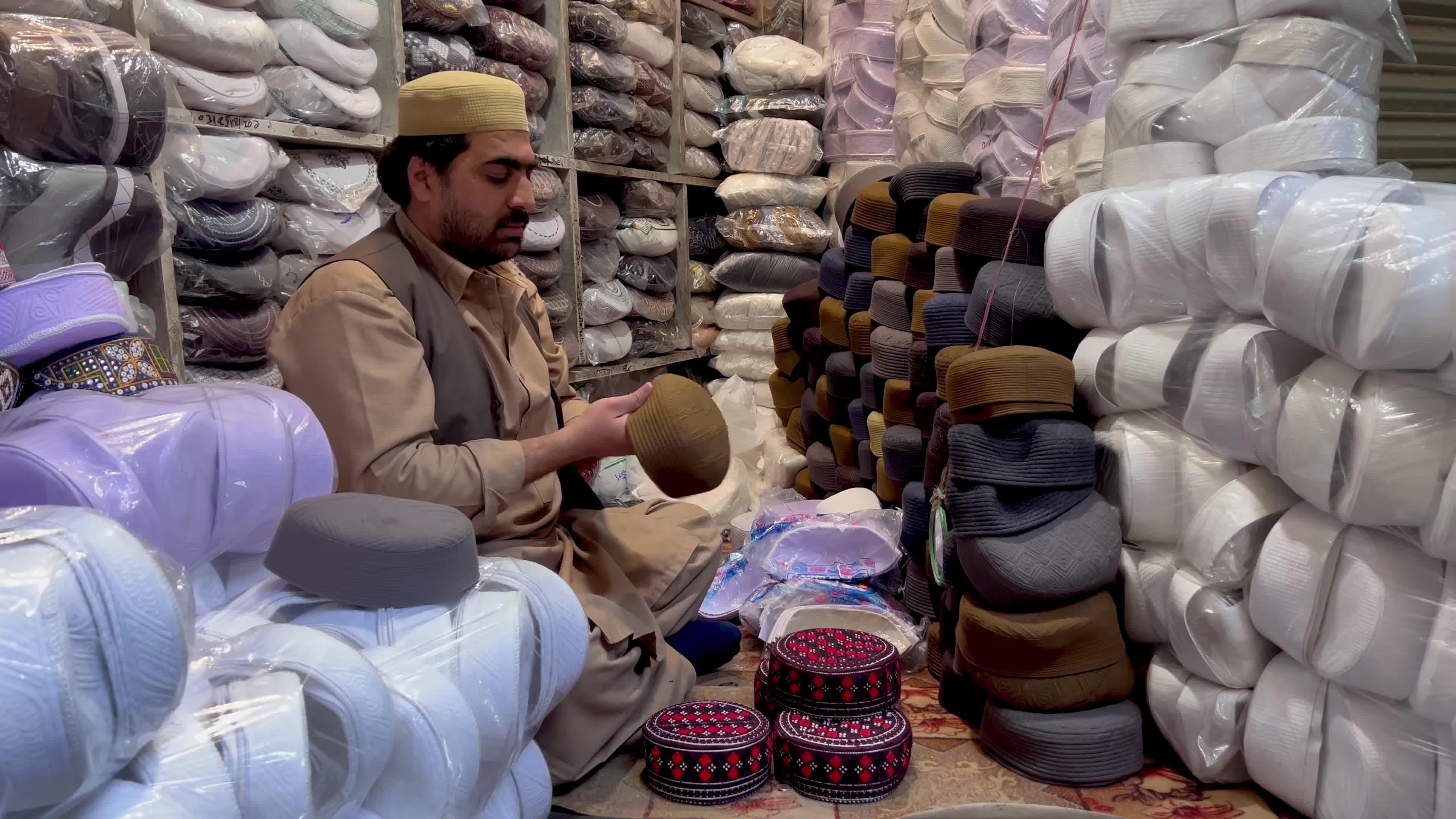 Prayer caps and beads on sale ahead of Ramadan in Peshawar