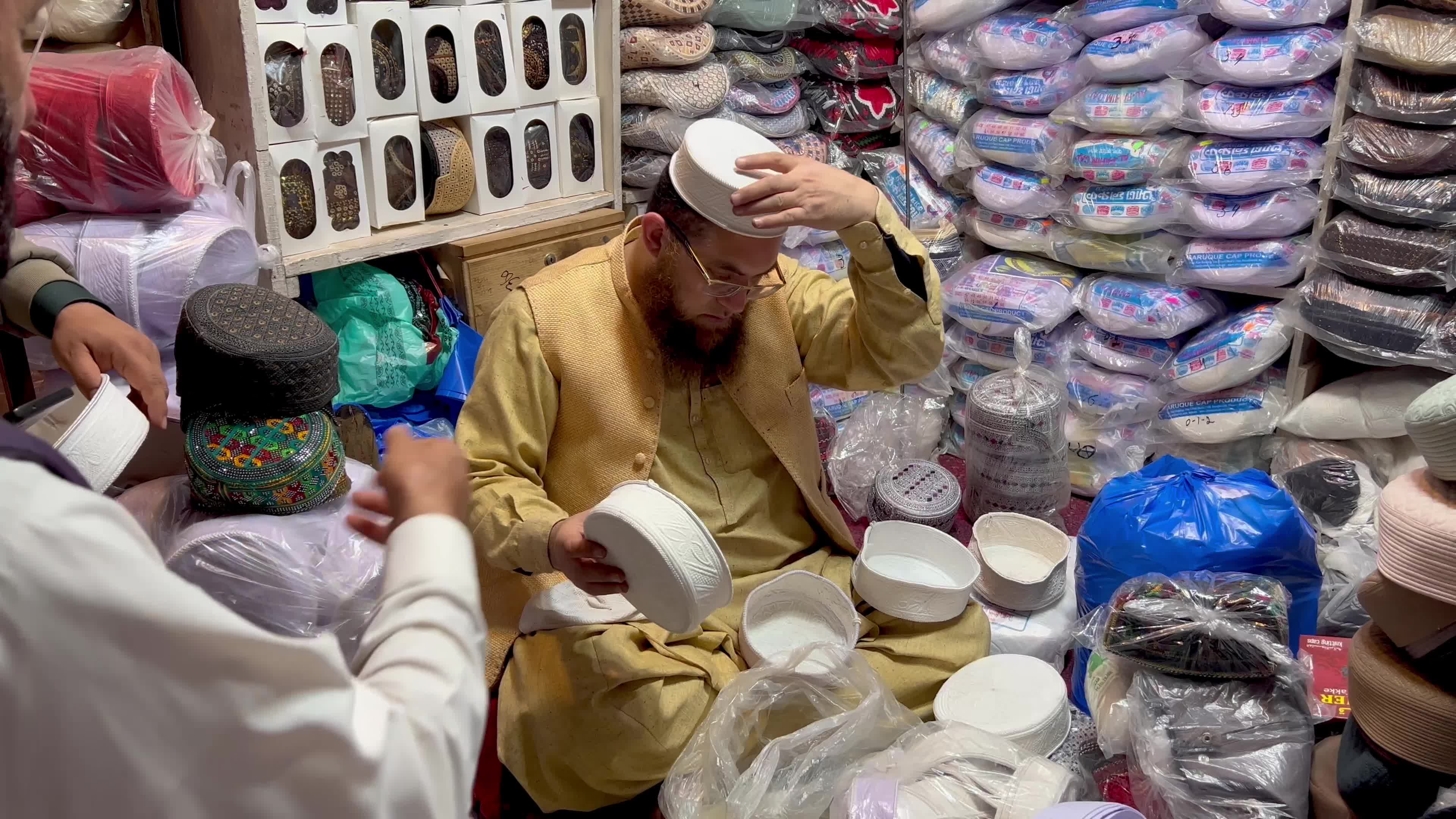 Prayer caps and beads on sale ahead of Ramadan in Peshawar