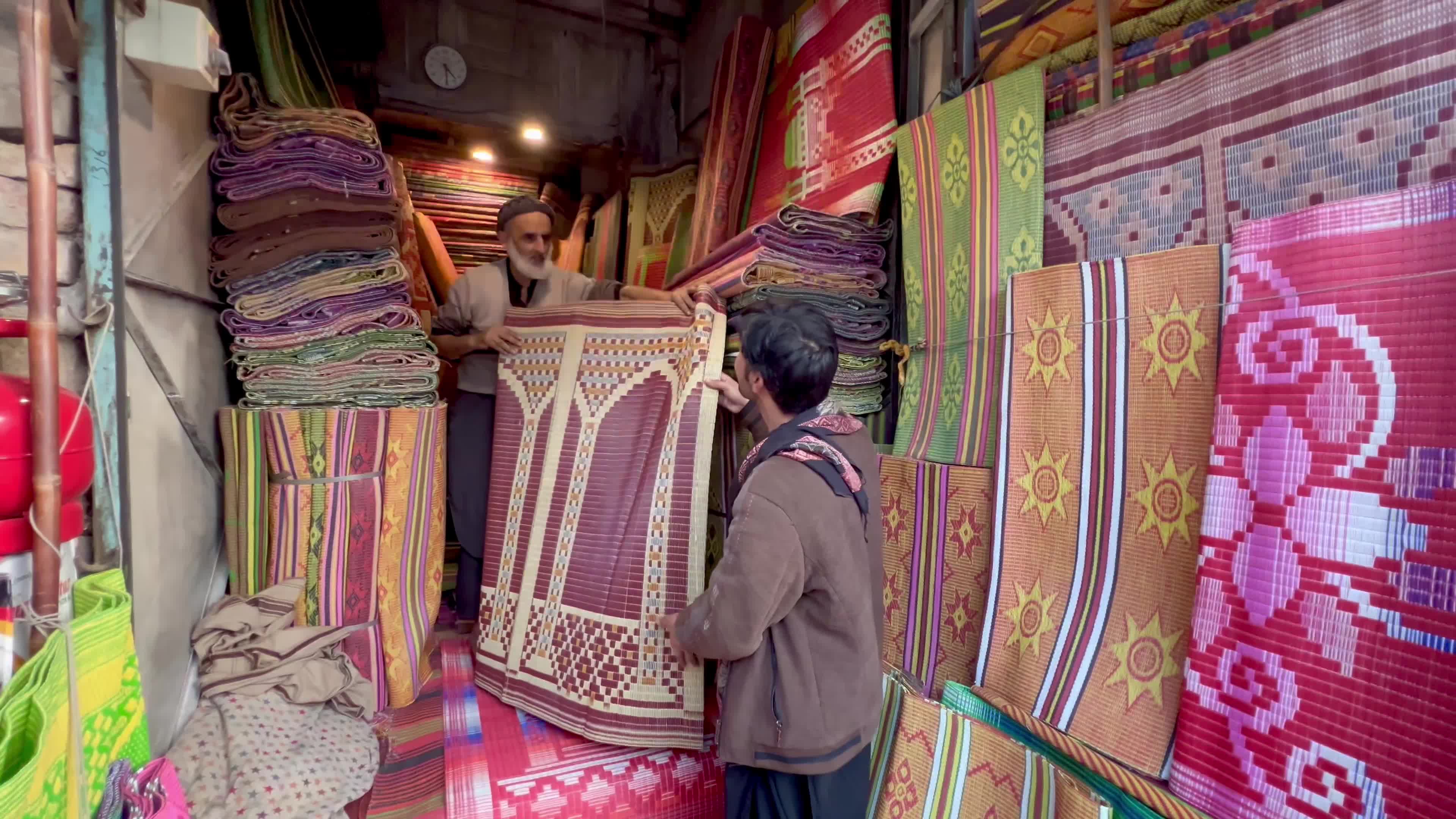 Vendors sell prayers mats and caps ahead of holy fasting month of Ramadan in Peshawar