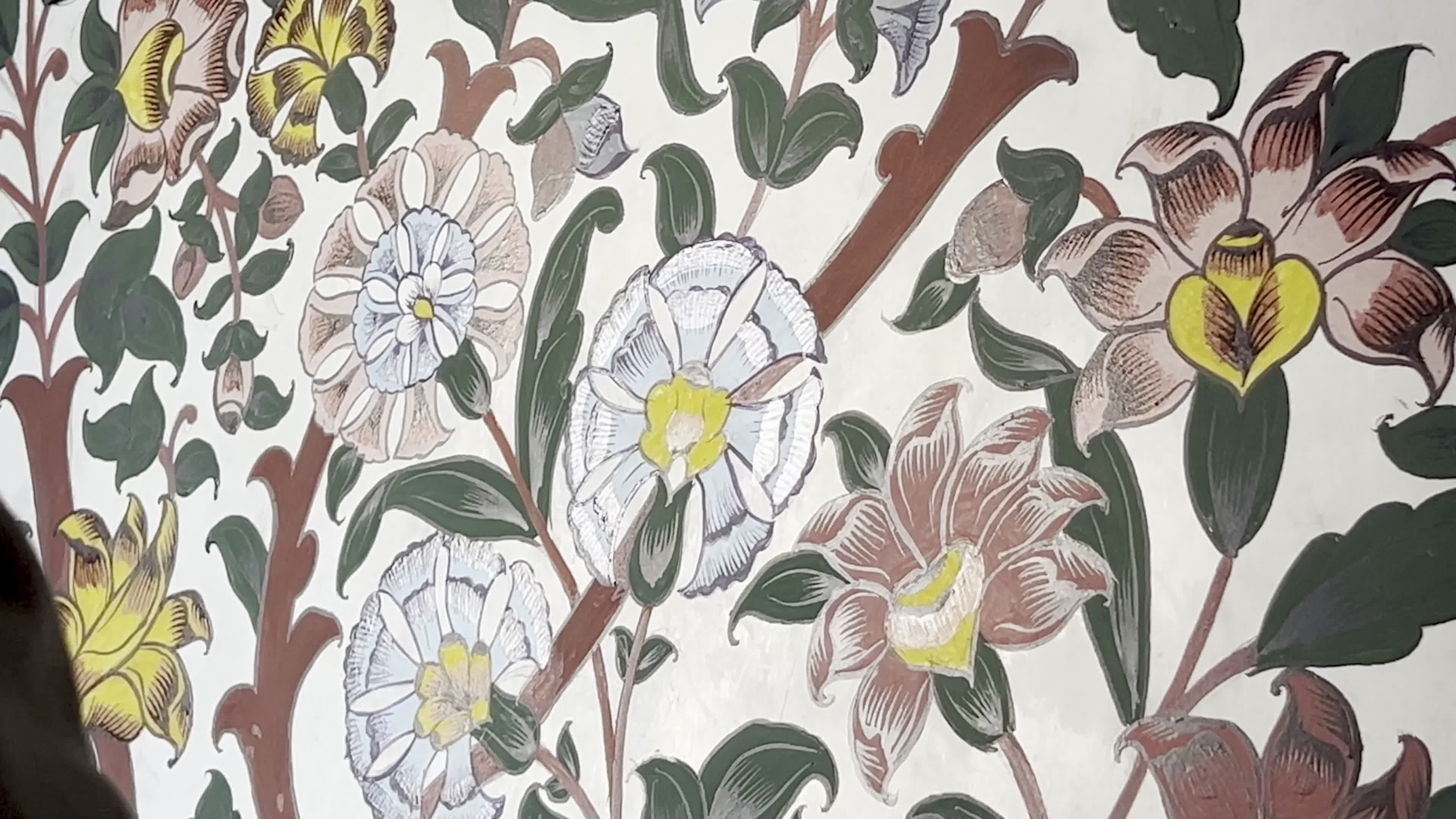 Artist Restores Floral Motifs at Historic Mohabbat Khan Mosque