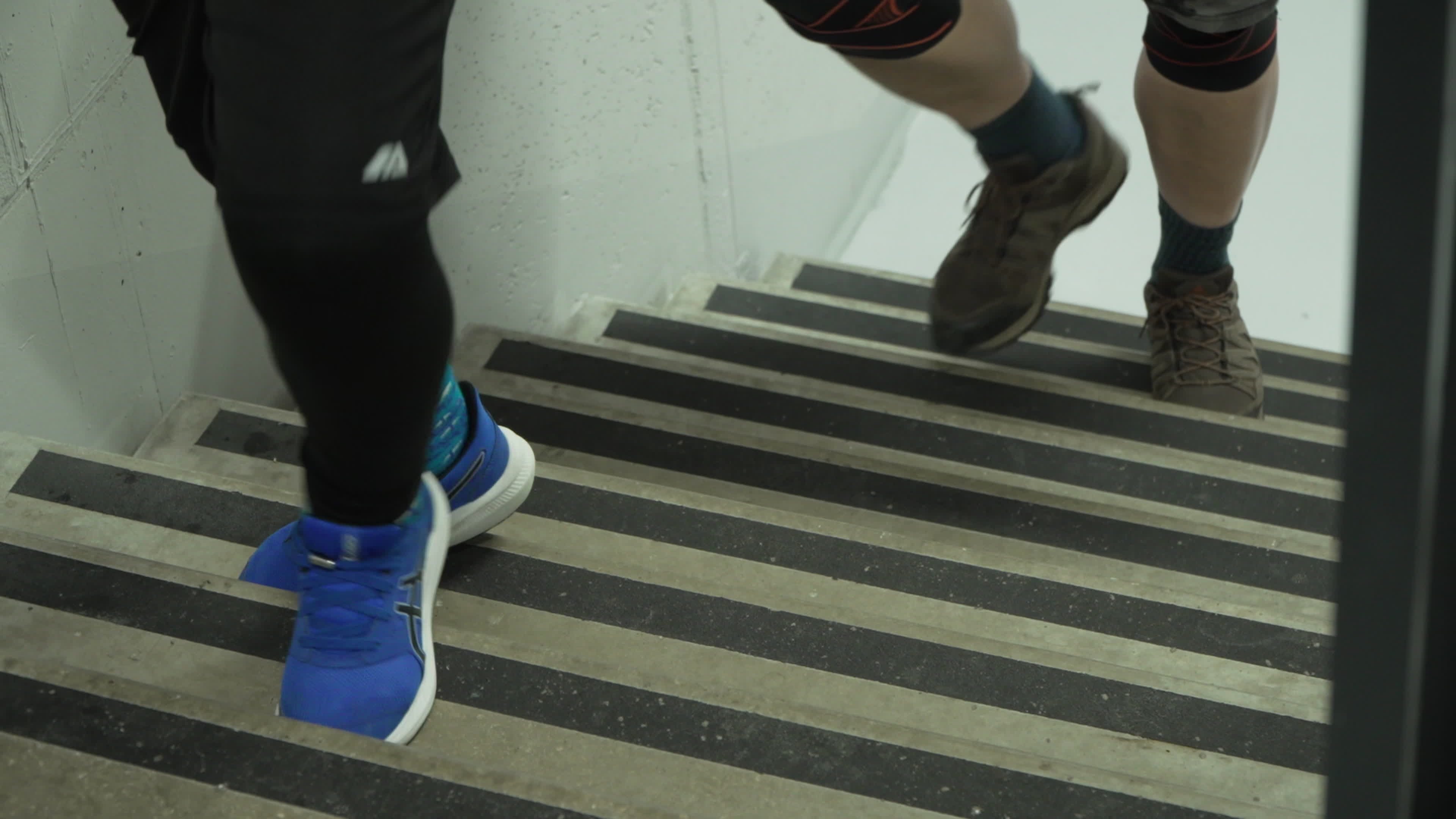 People take part in "Everest" skyscraper run