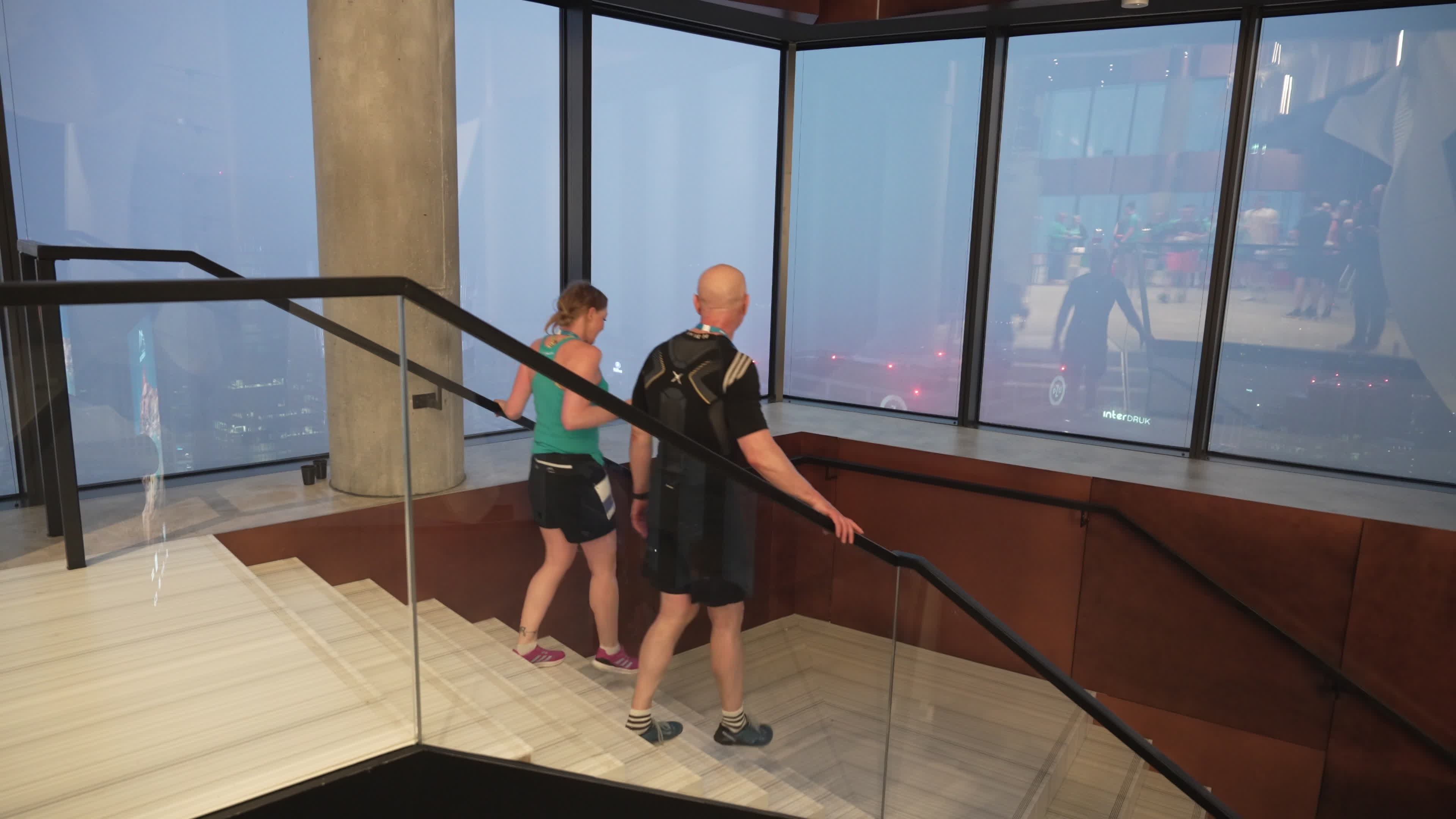 People take part in "Everest" skyscraper run