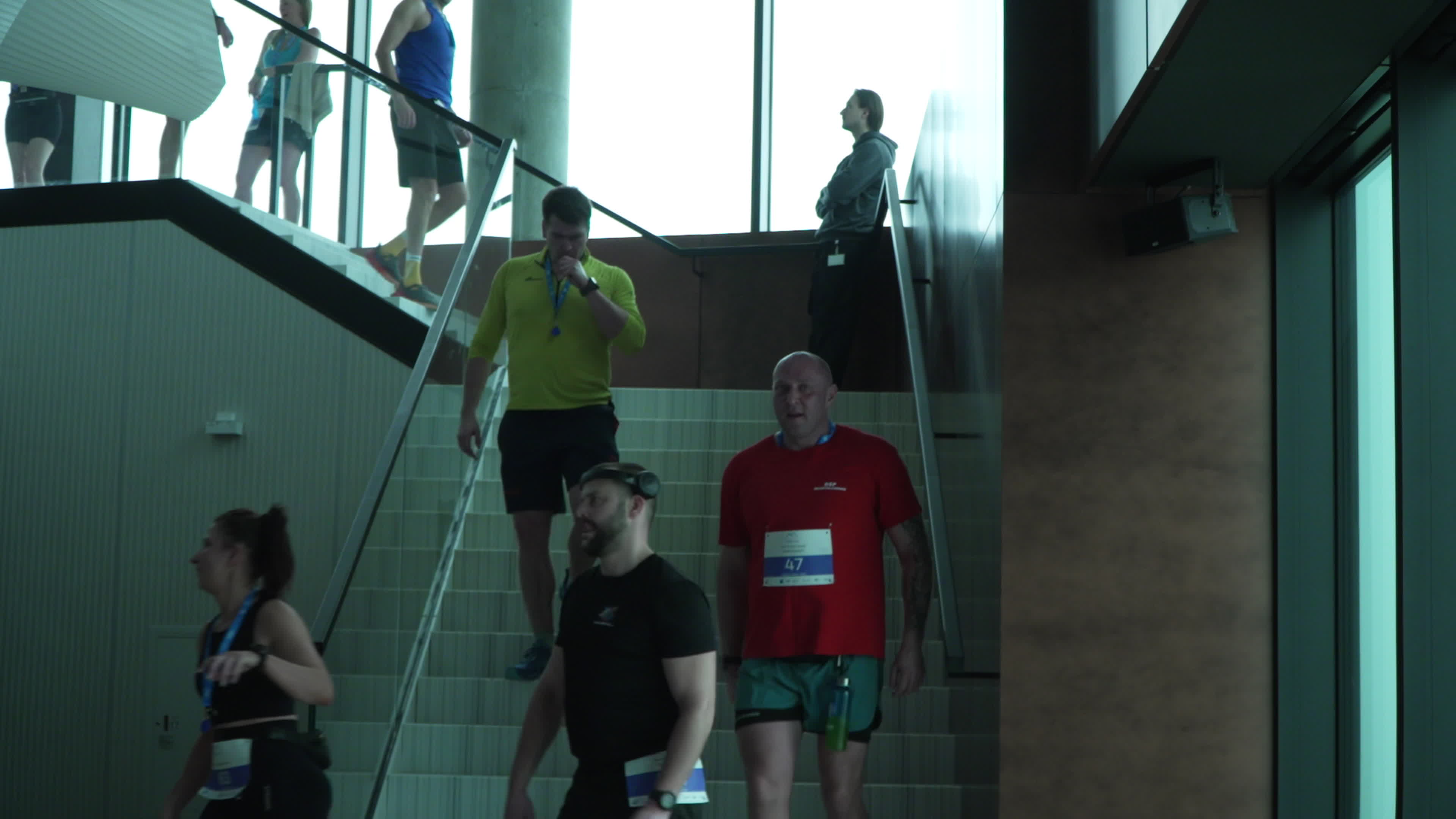 People take part in "Everest" skyscraper run