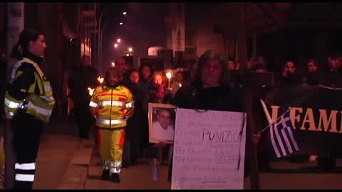 Torchlight procession for earthquake victims in L'Aquila