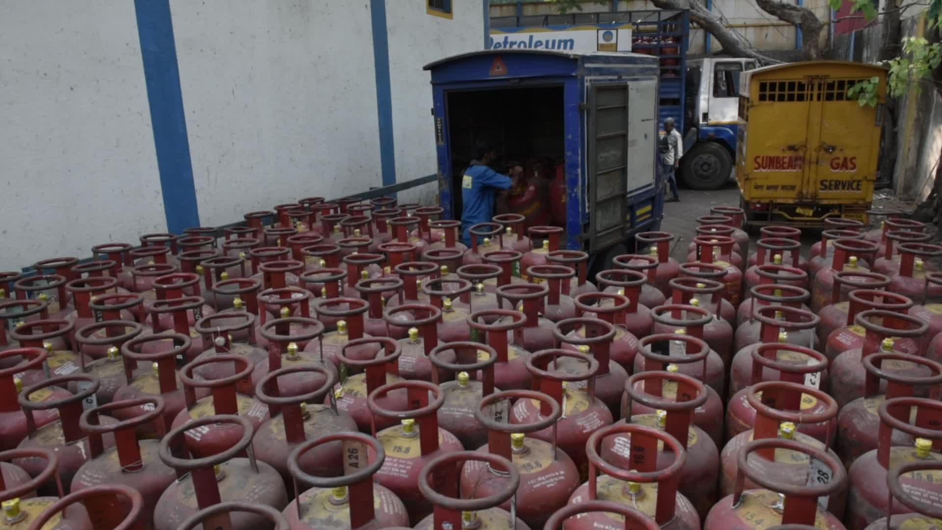 Workers Load Cylinders Amid India’s Widening LPG Supply Crunch
