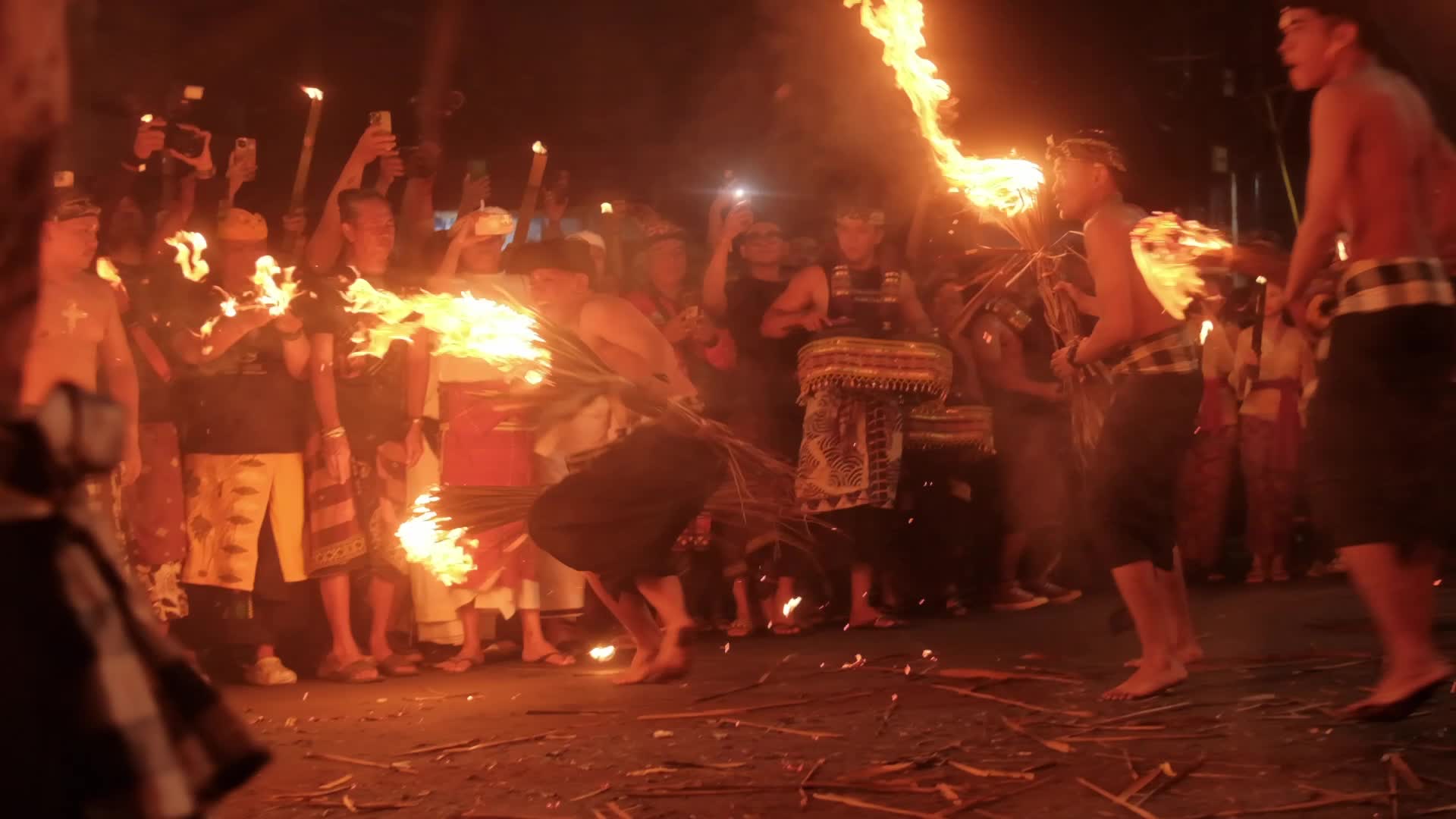 The Lukat Geni tradition of fire war before Nyepi Day on the island of Bali, Indonesia.