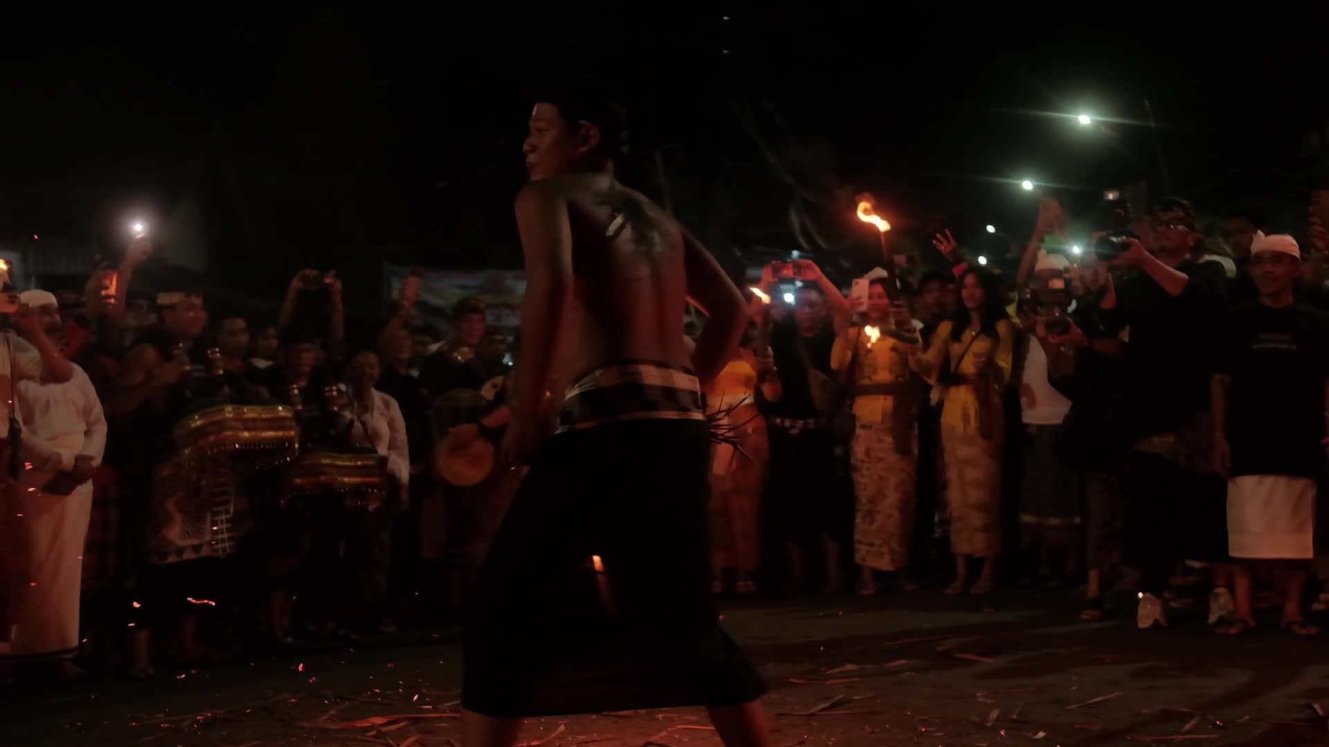 The Lukat Geni tradition of fire war before Nyepi Day on the island of Bali, Indonesia.