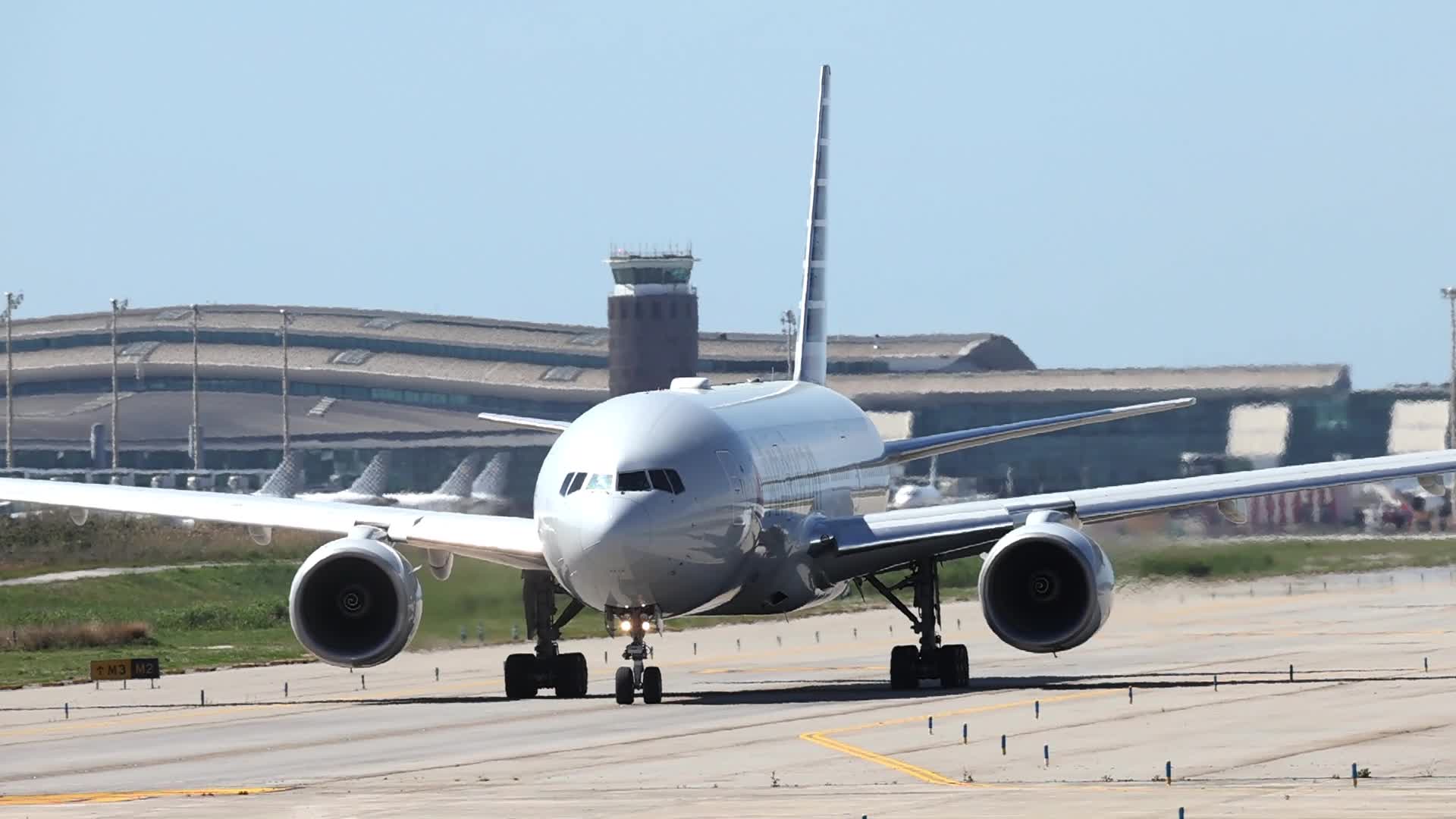 An American Airlines Boeing 777 taking off from Barcelona Airport