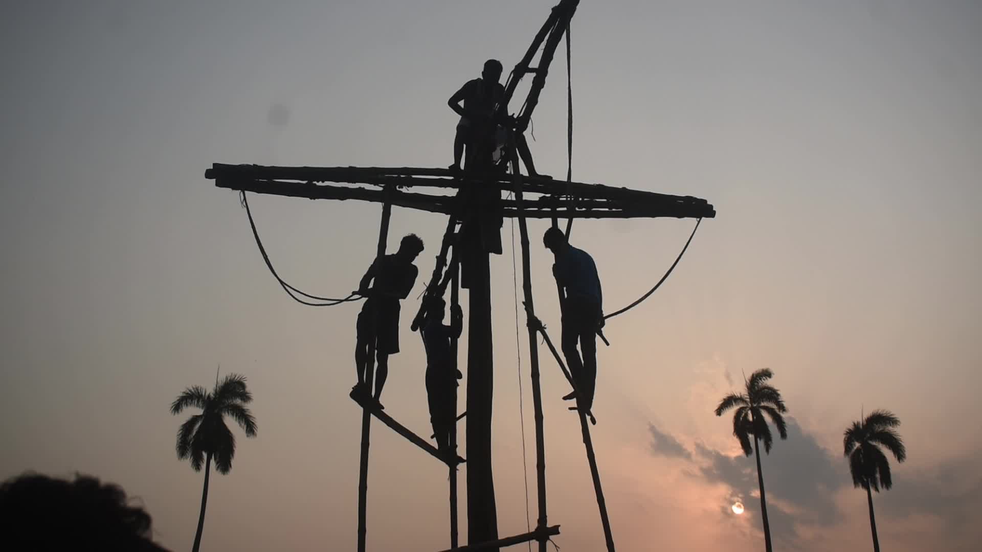 Devotees perform Charak Puja rituals on the outskirts of Kolkata