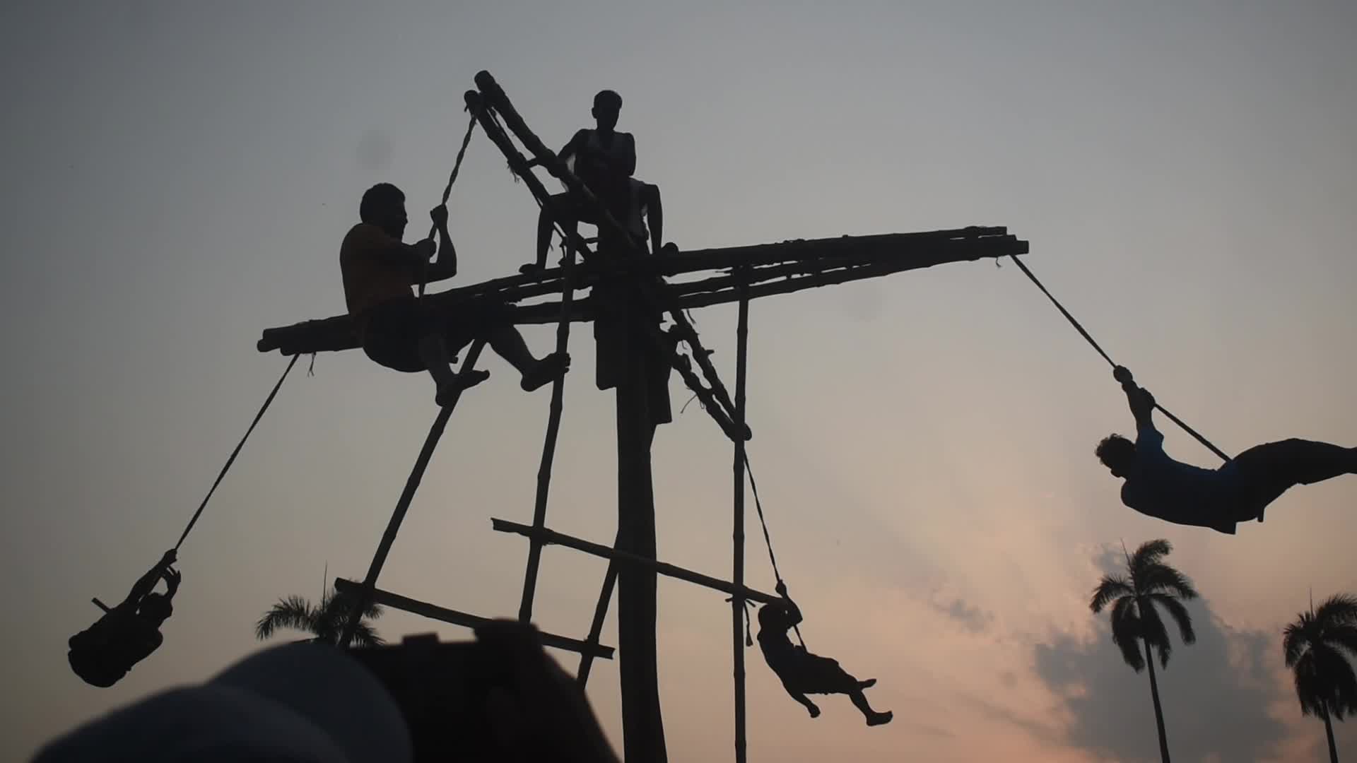 Devotees perform Charak Puja rituals on the outskirts of Kolkata