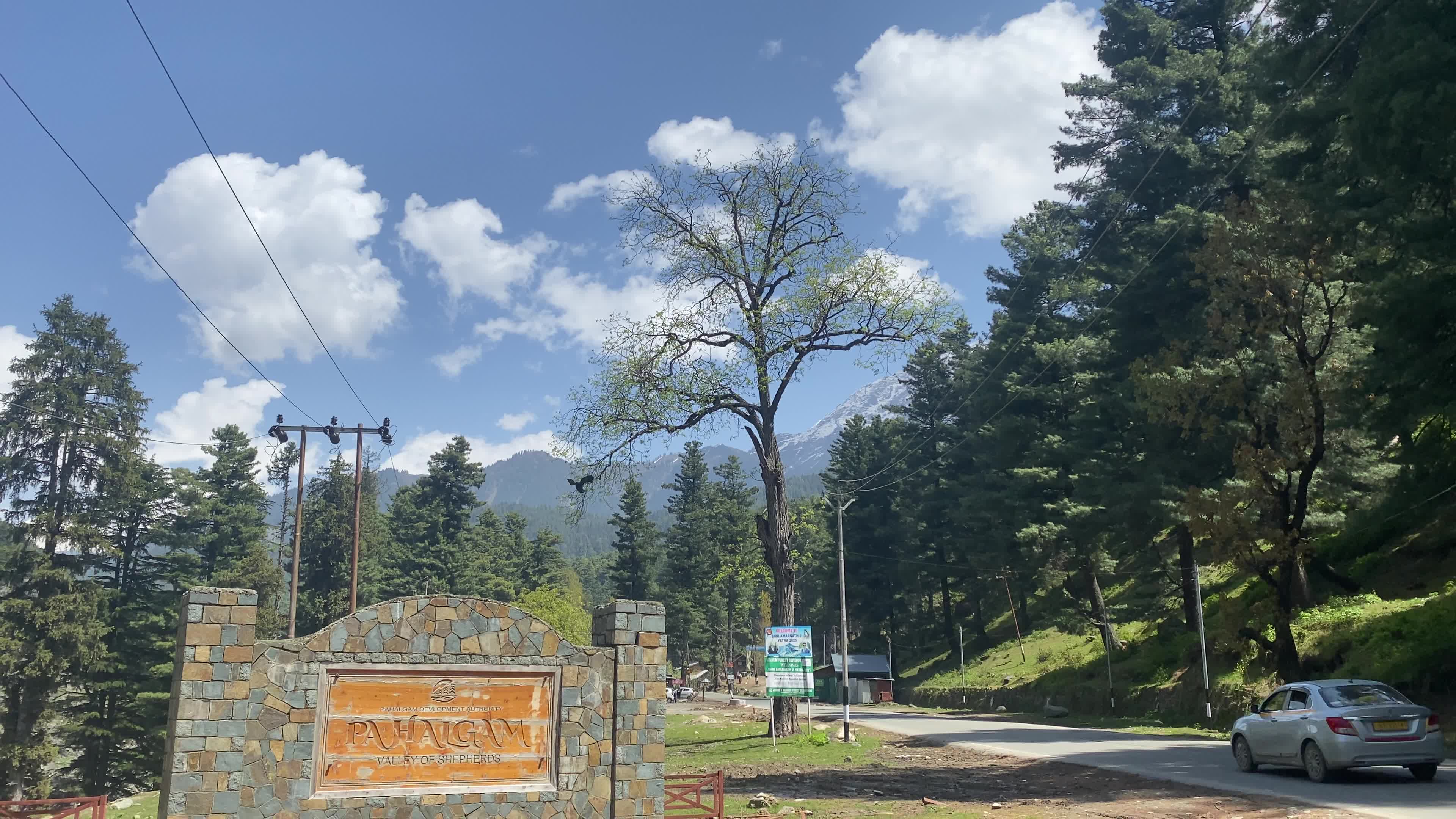 Pahalgam, in Indian side of Kashmir, is seen on a clear sunny day, as lush green valleys and surrounding hills are illuminated under bright skies.
