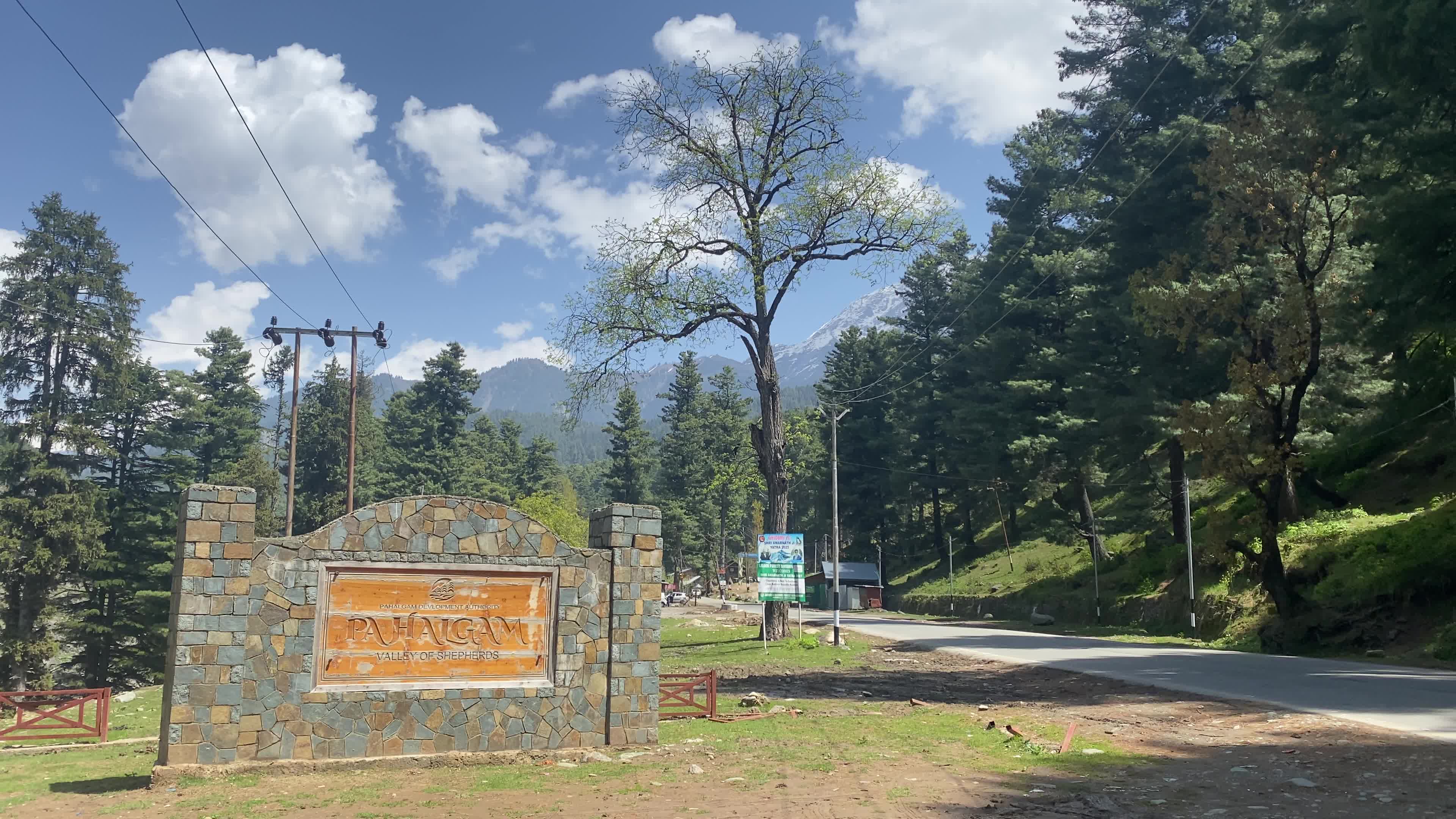 Pahalgam, in Indian side of Kashmir, is seen on a clear sunny day, as lush green valleys and surrounding hills are illuminated under bright skies.