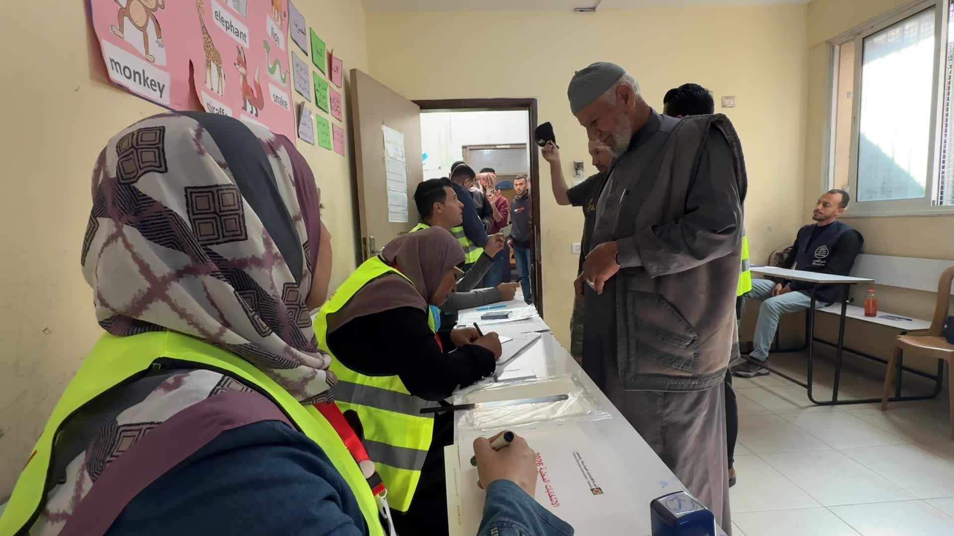 Palestinians vote during the municipal election at a polling station in Deir al-Balah