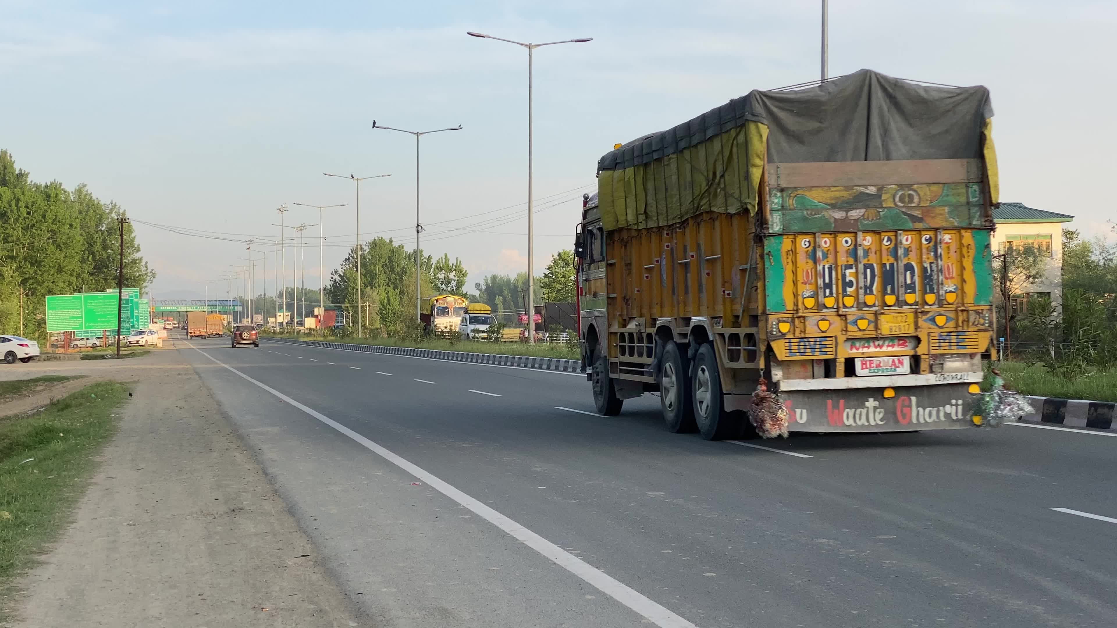 Vehicles move on National Highway (NH-44) in Srinagar on a sunny summer day