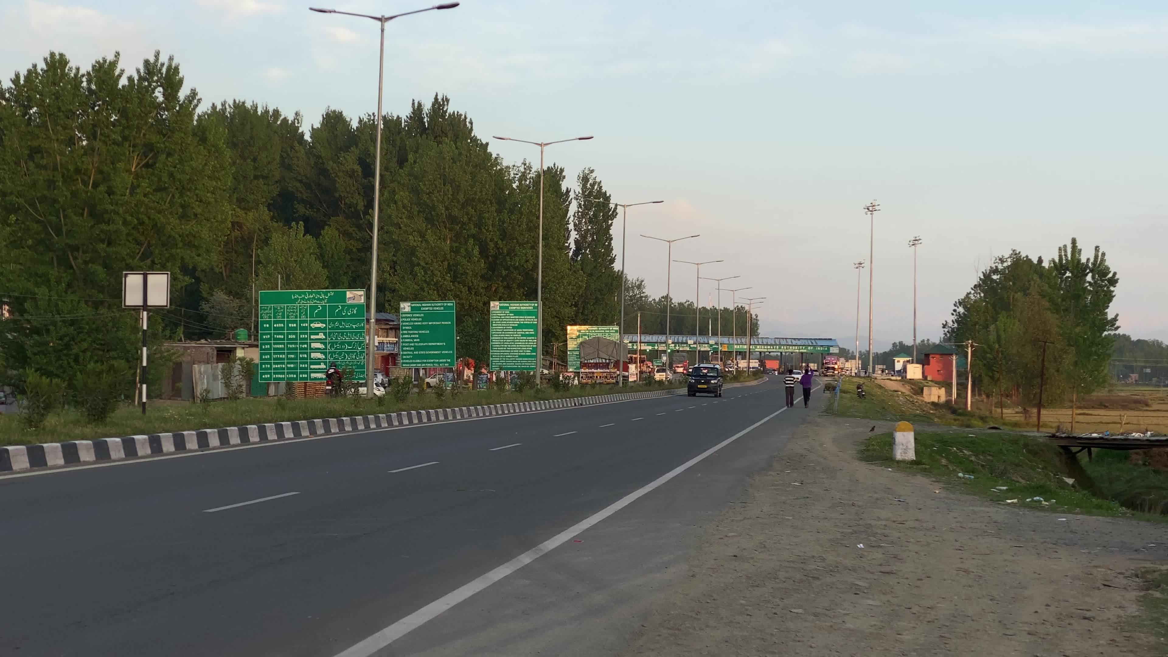 Vehicles move on National Highway (NH-44) in Srinagar on a sunny summer day