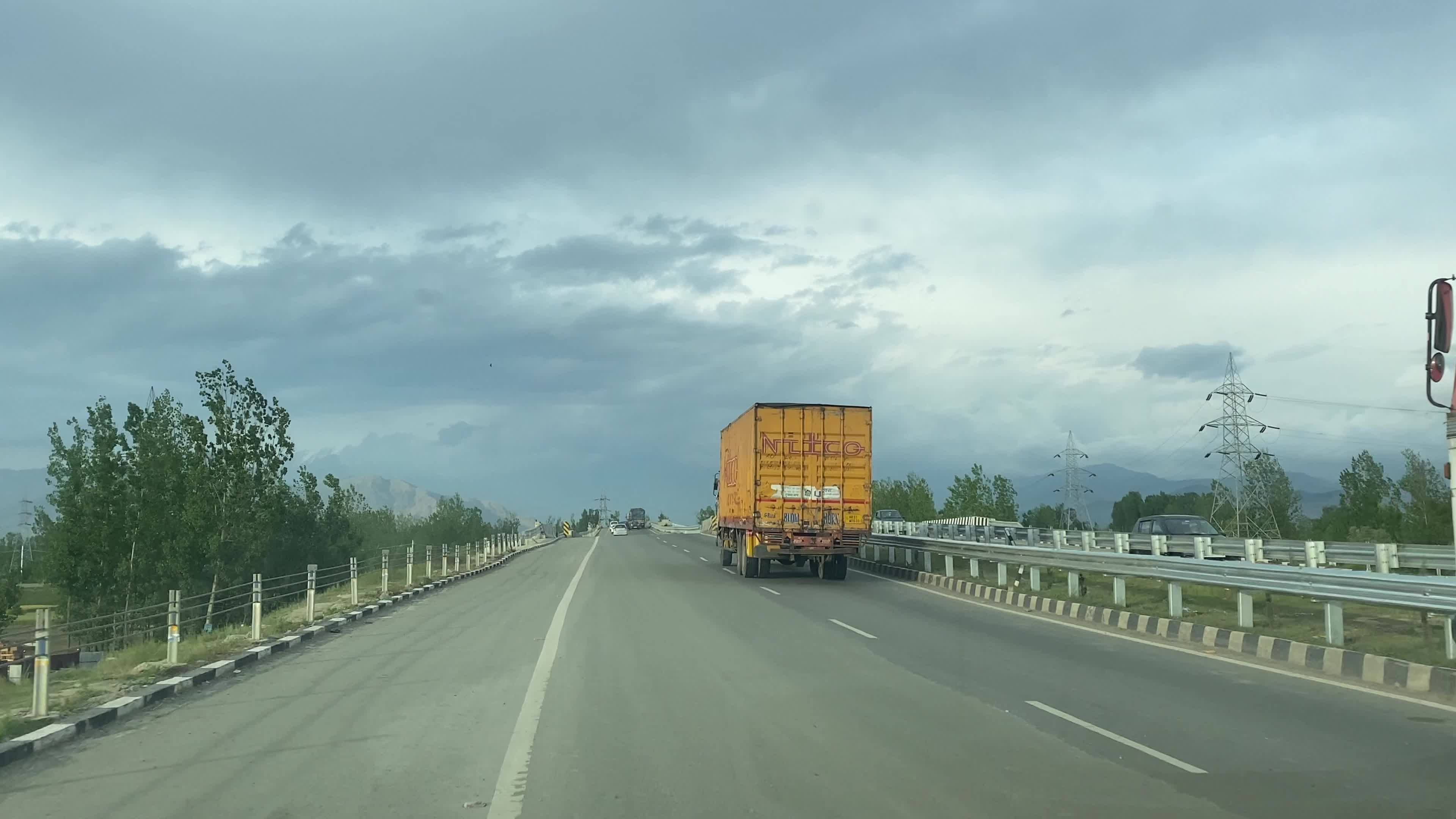 Vehicles move along the Srinagar–Jammu National Highway