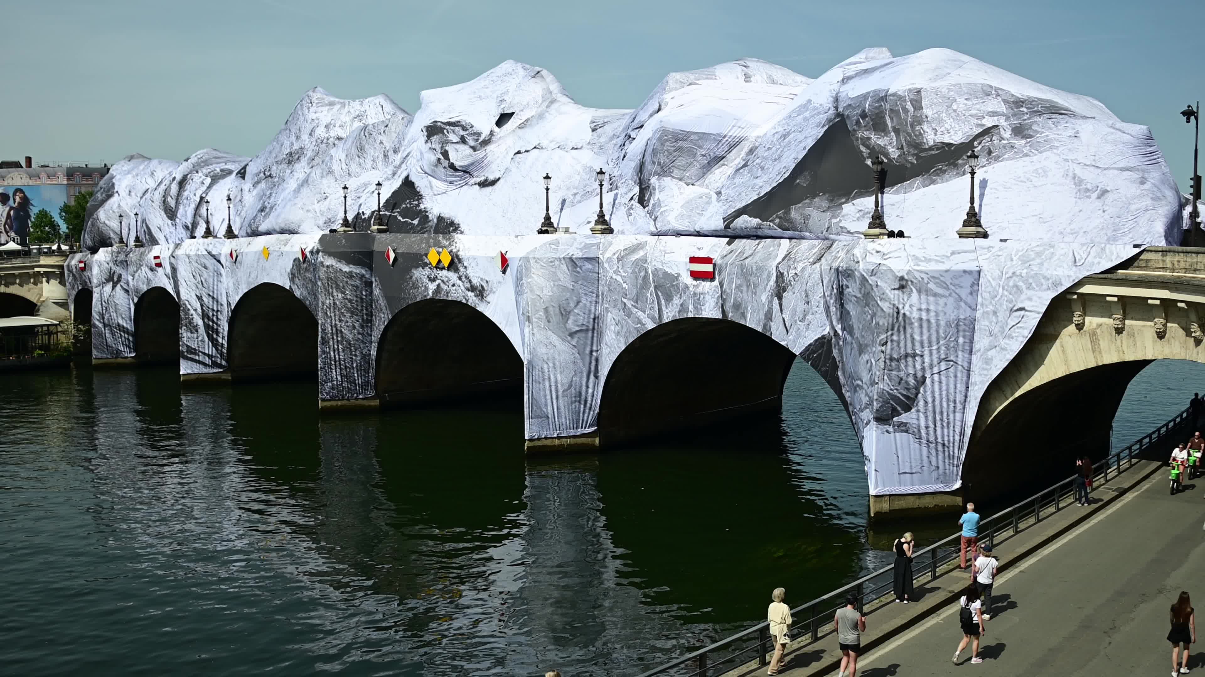 JR Unveils His New Monumental Installation "La Caverne du Pont Neuf" In Paris