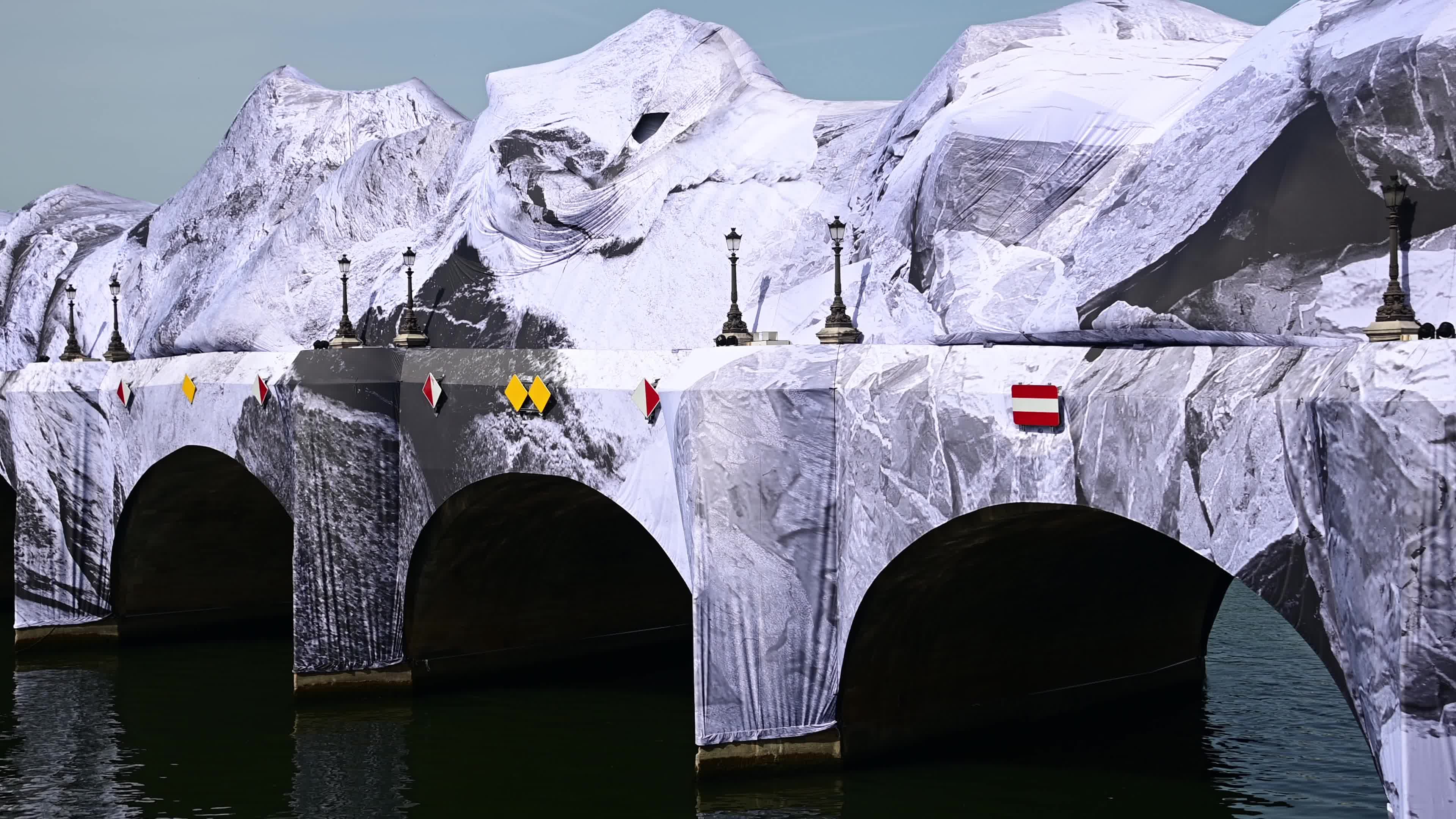 JR Unveils His New Monumental Installation "La Caverne du Pont Neuf" In Paris