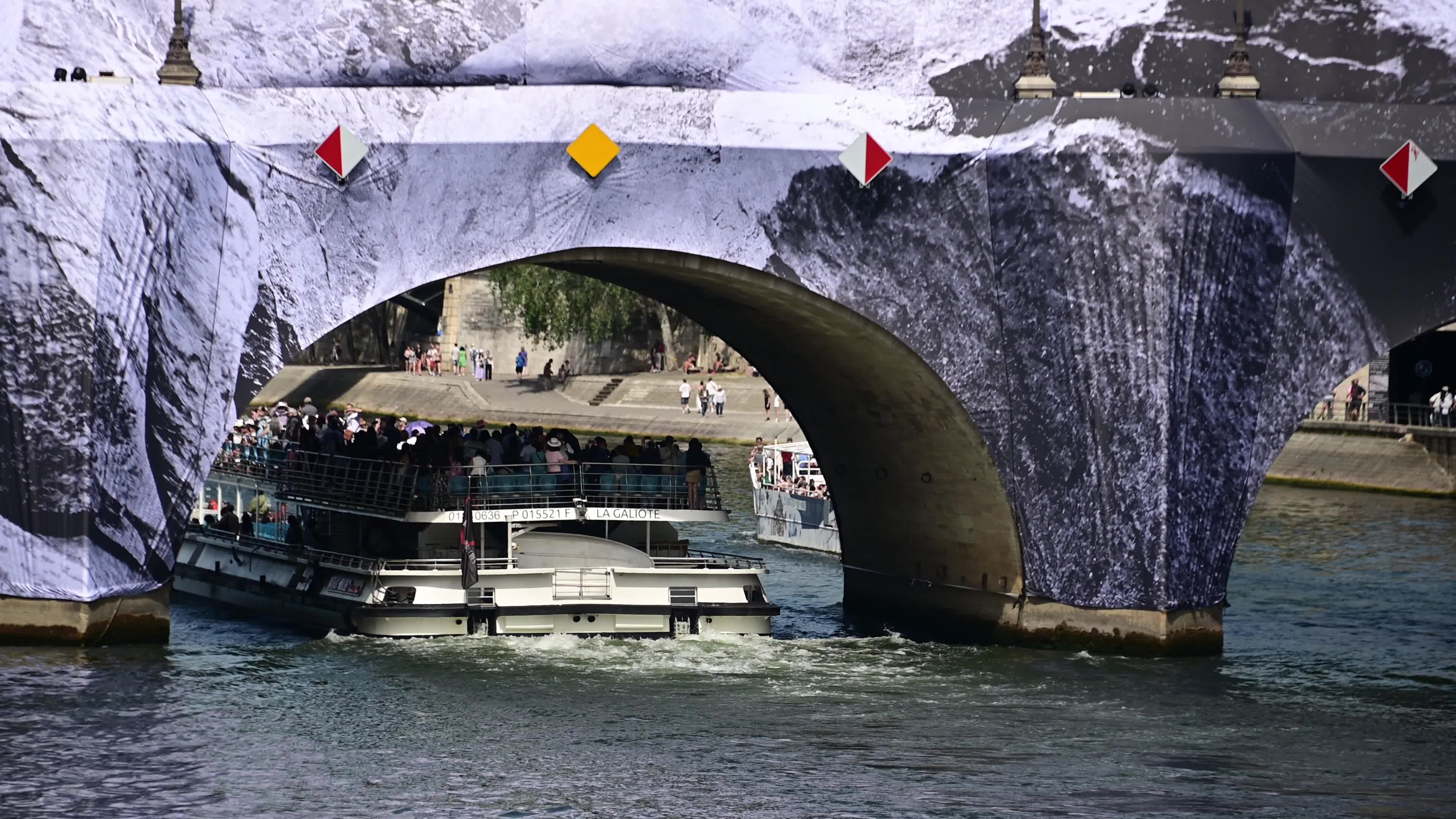 JR Unveils His New Monumental Installation "La Caverne du Pont Neuf" In Paris