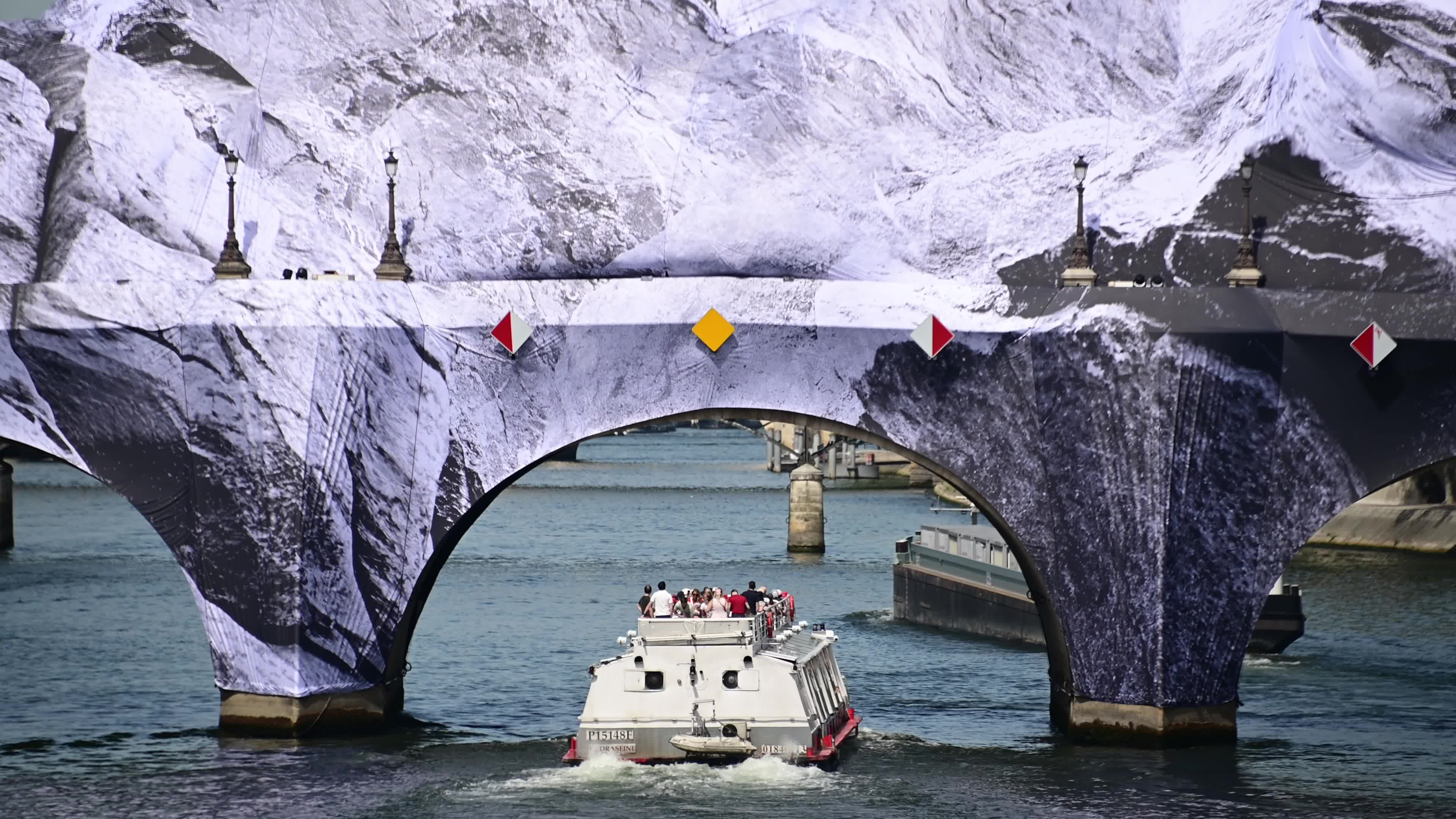 JR Unveils His New Monumental Installation "La Caverne du Pont Neuf" In Paris