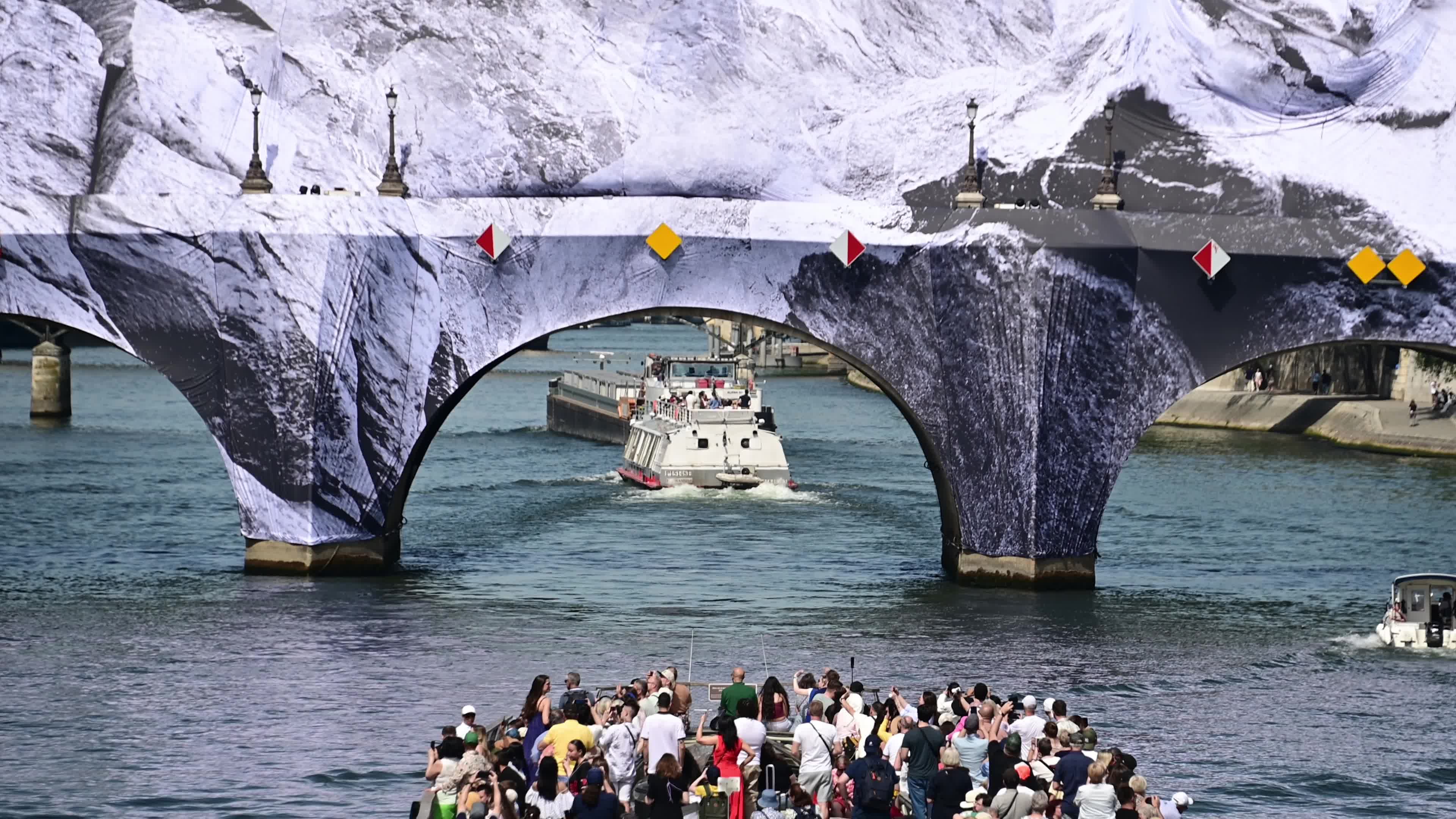 JR Unveils His New Monumental Installation "La Caverne du Pont Neuf" In Paris