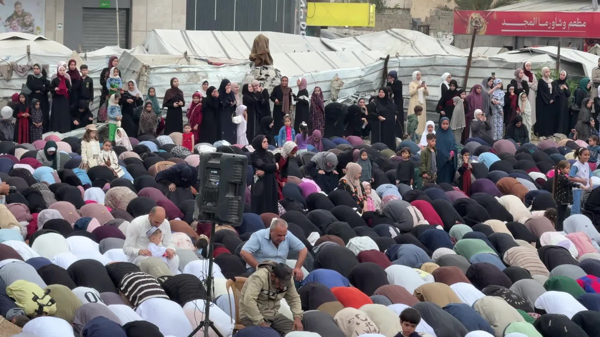 Palestinian Muslims attend the Eid al-Adha prayer, in Gaza City