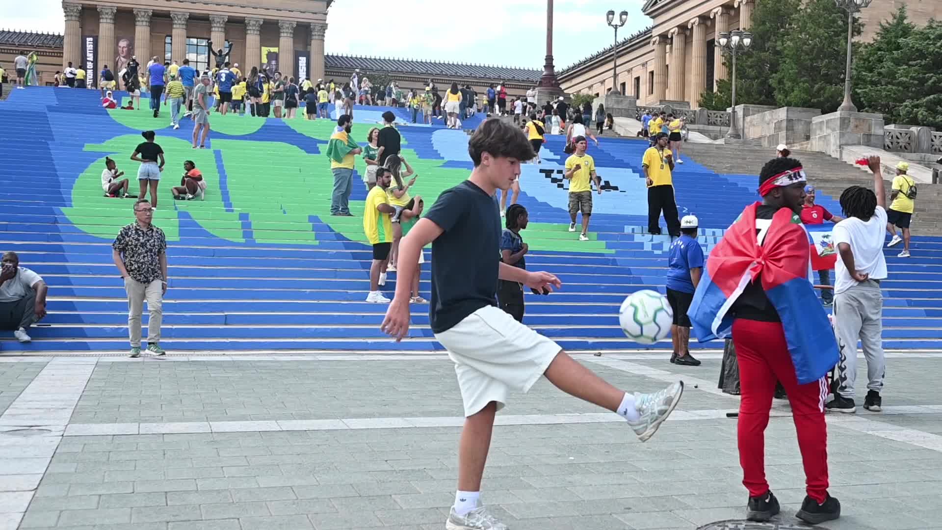 Soccer fans gather at the famous Rocky Steps in Philadelphia