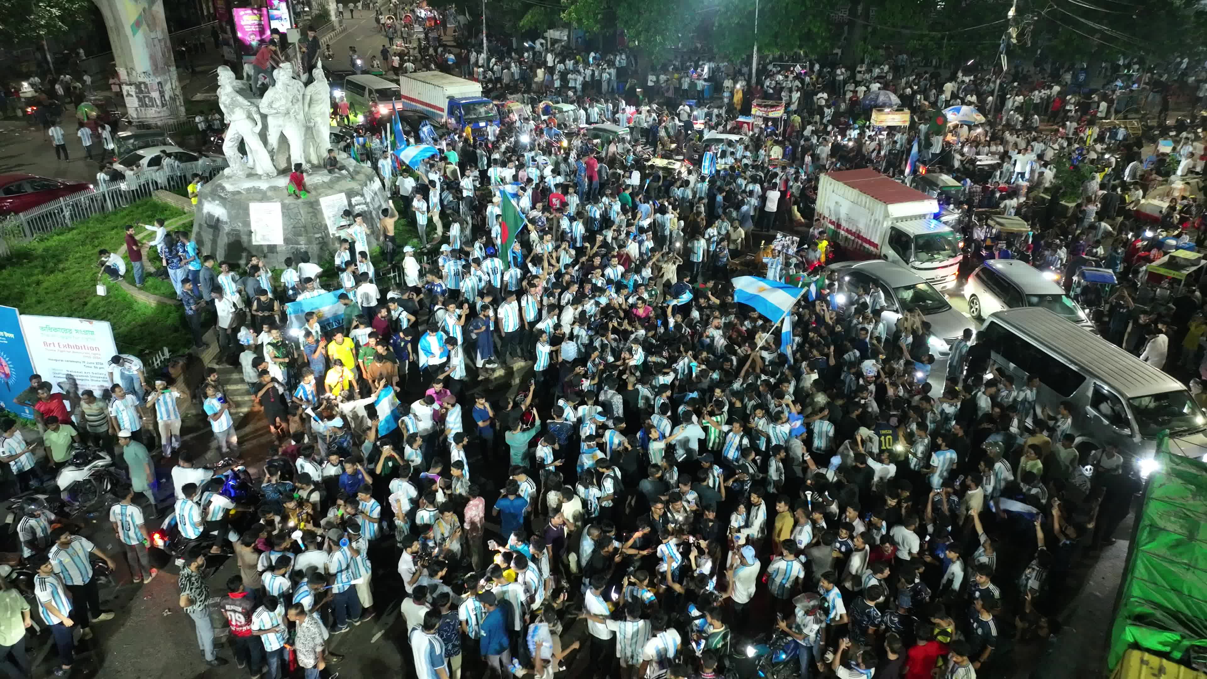 Football Fans Watch Argentina and Austria Football Match in Dhaka.