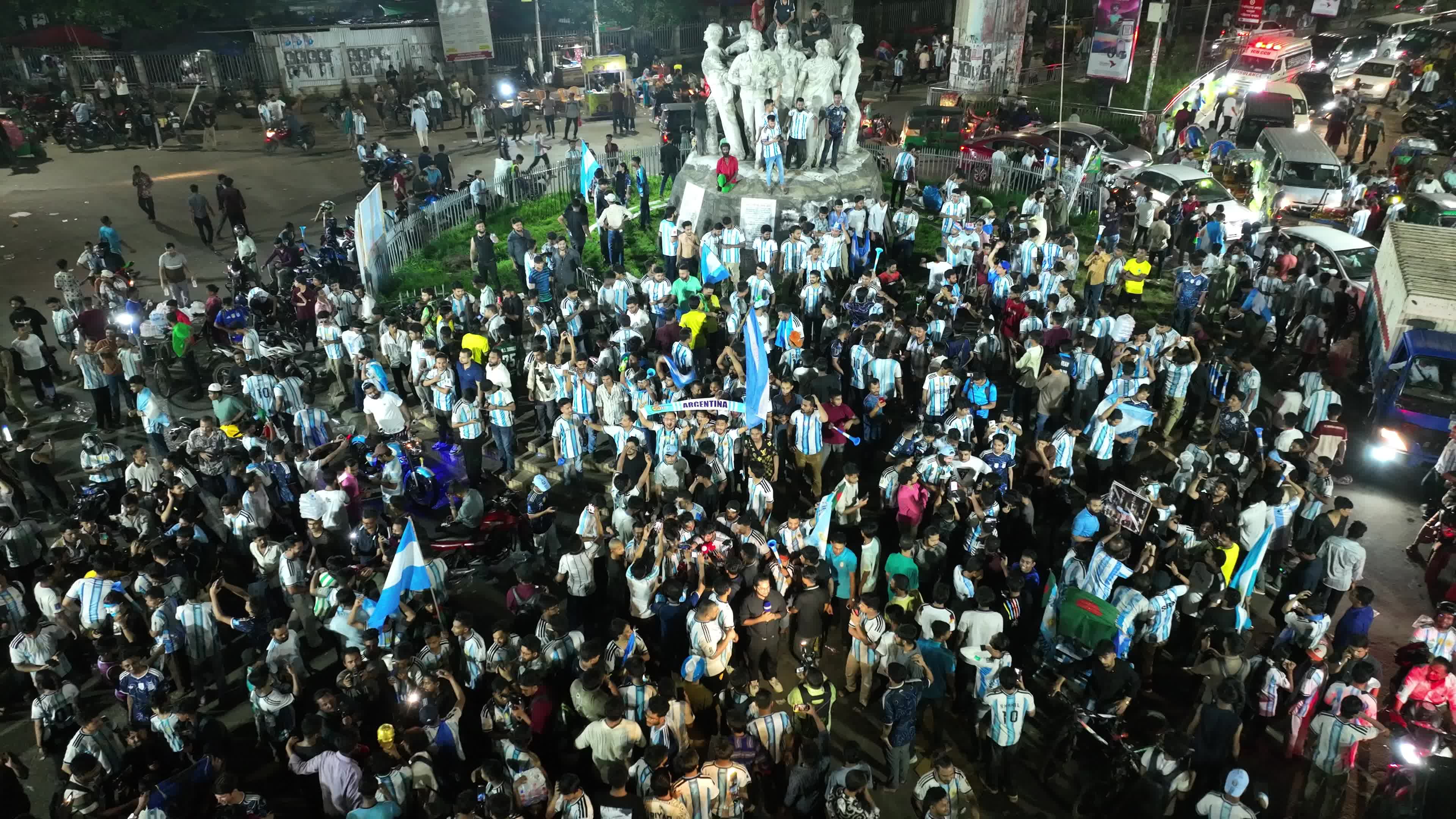 Football Fans Watch Argentina and Austria Football Match in Dhaka.