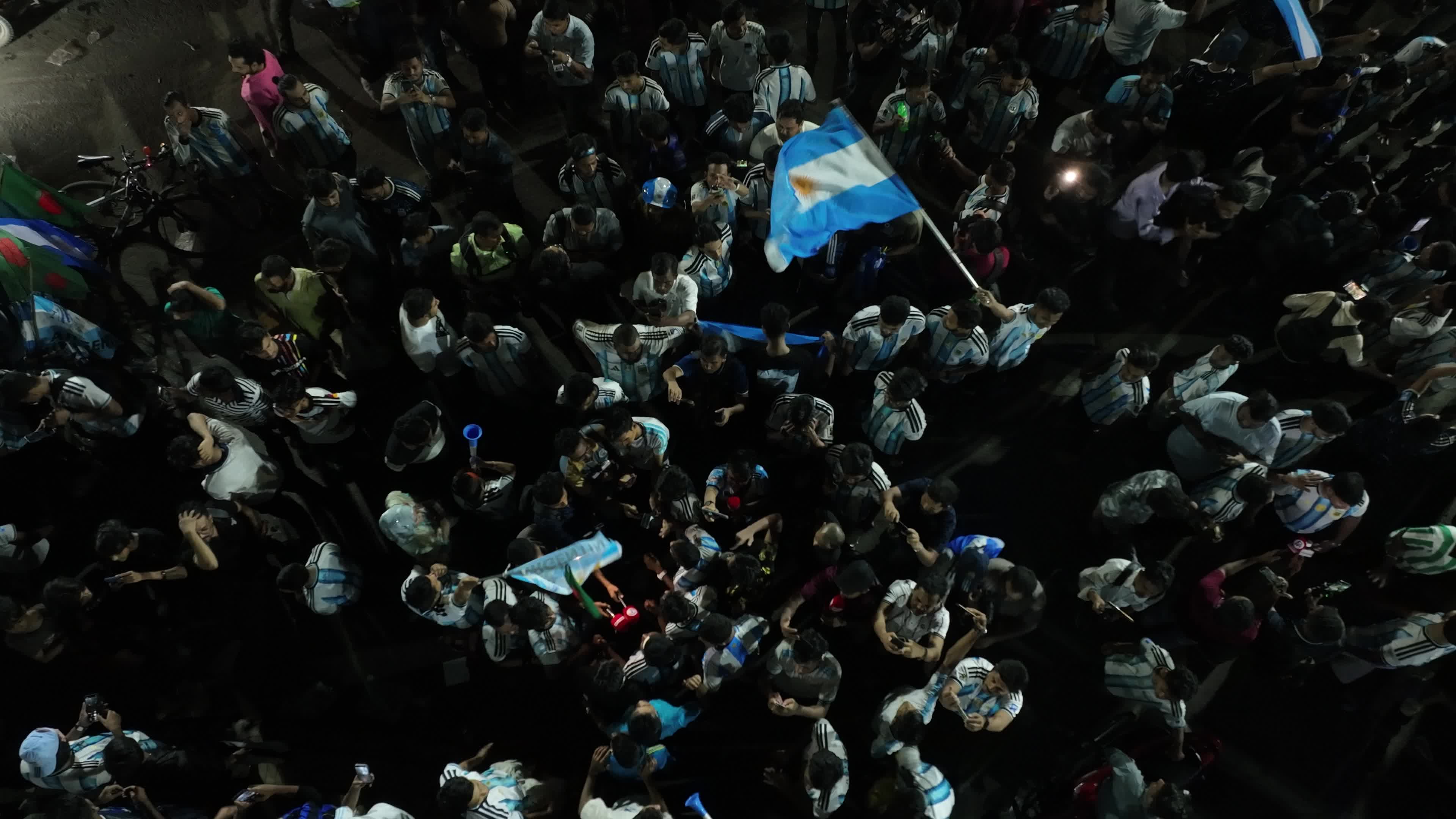 Football Fans Watch Argentina and Austria Football Match in Dhaka.