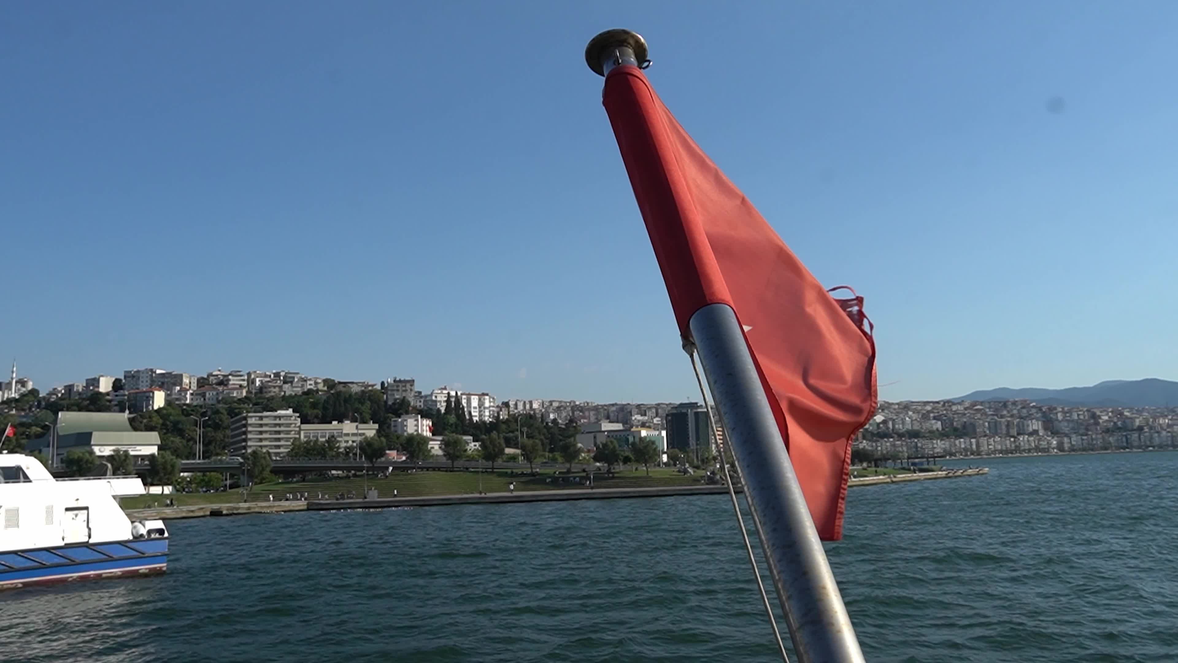 The Turkish national flag waving on a flagpole