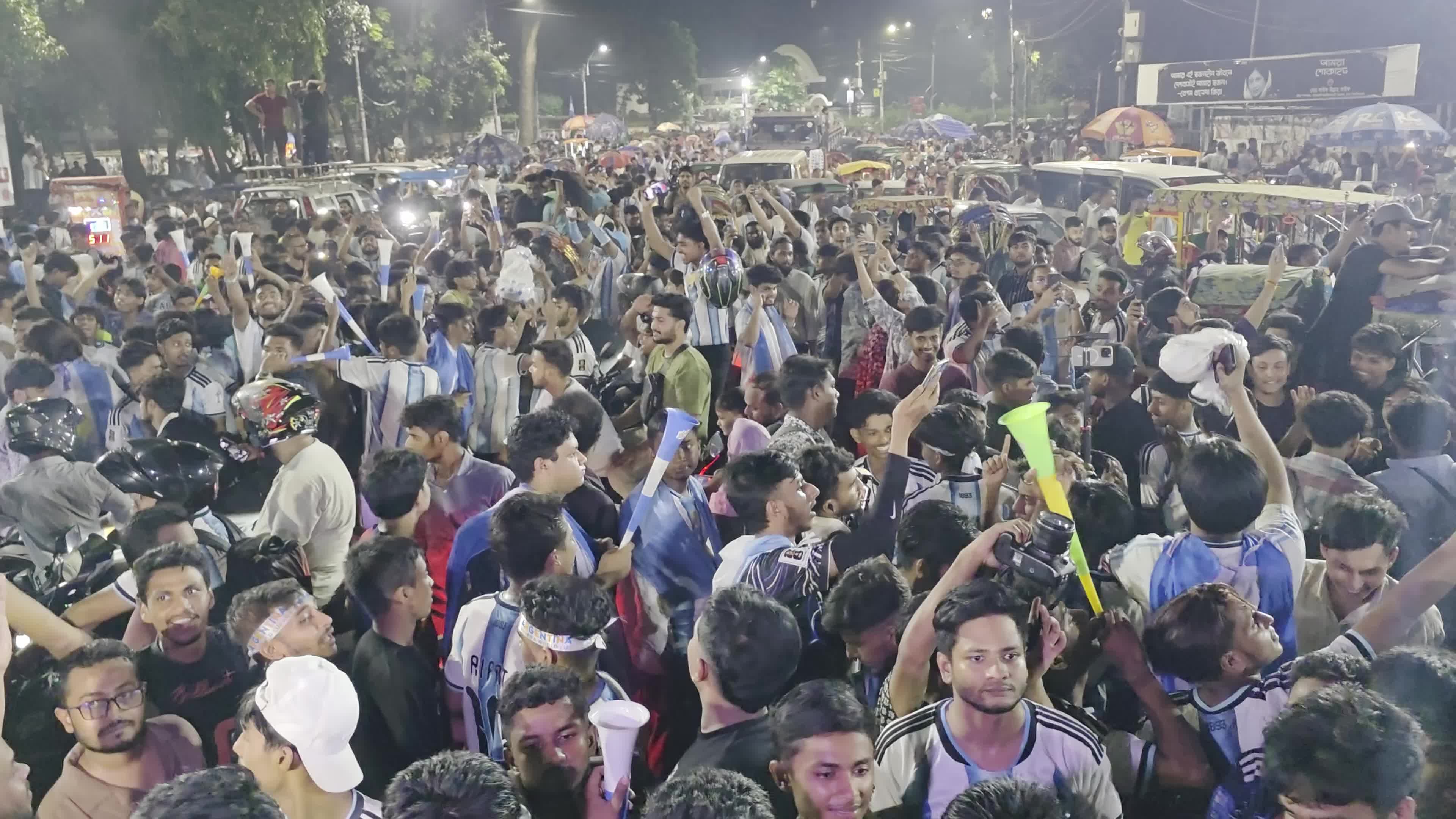 Football Fans Watch Argentina and Austria Football Match in Dhaka