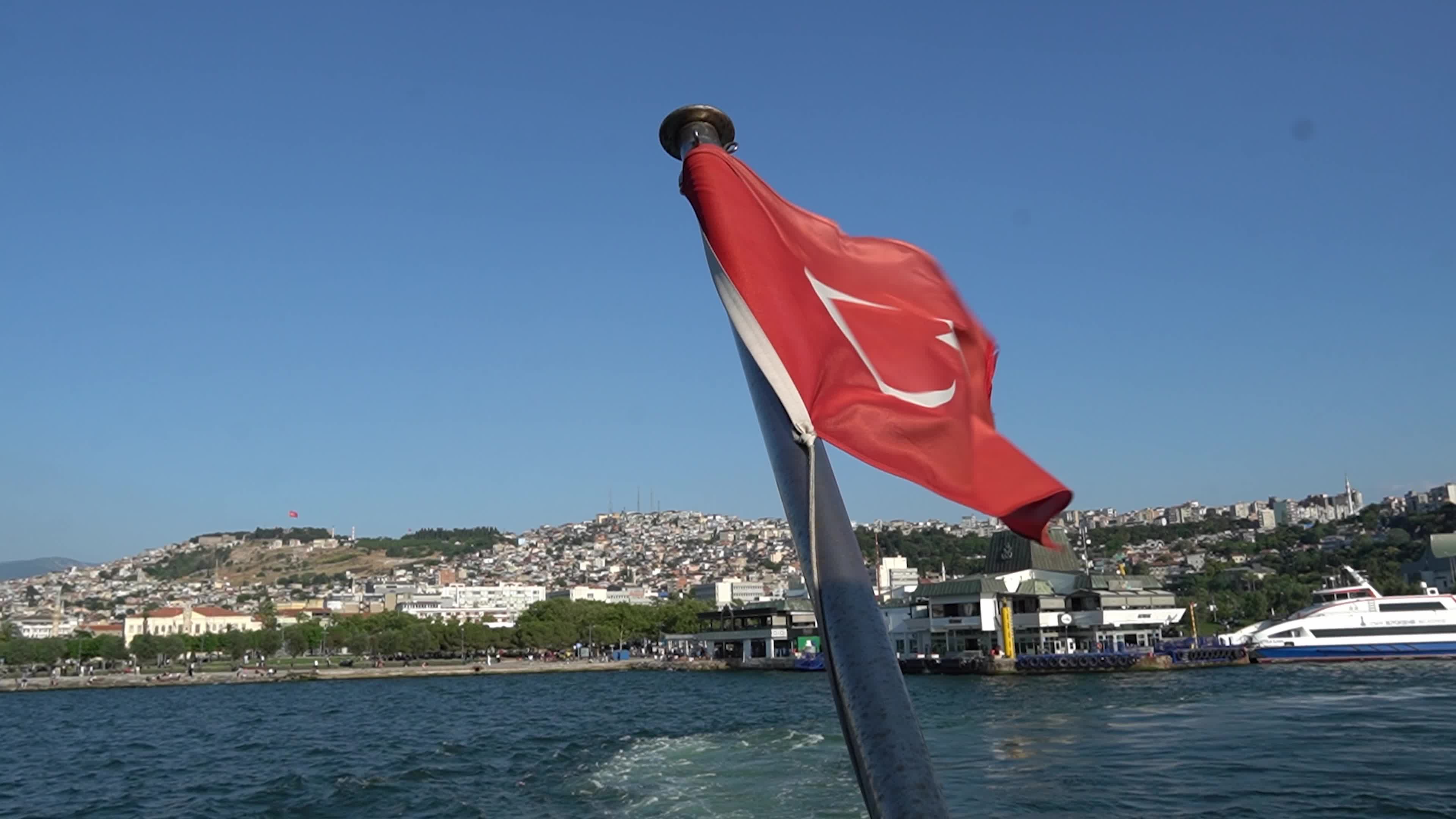 The Turkish national flag waving on a flagpole