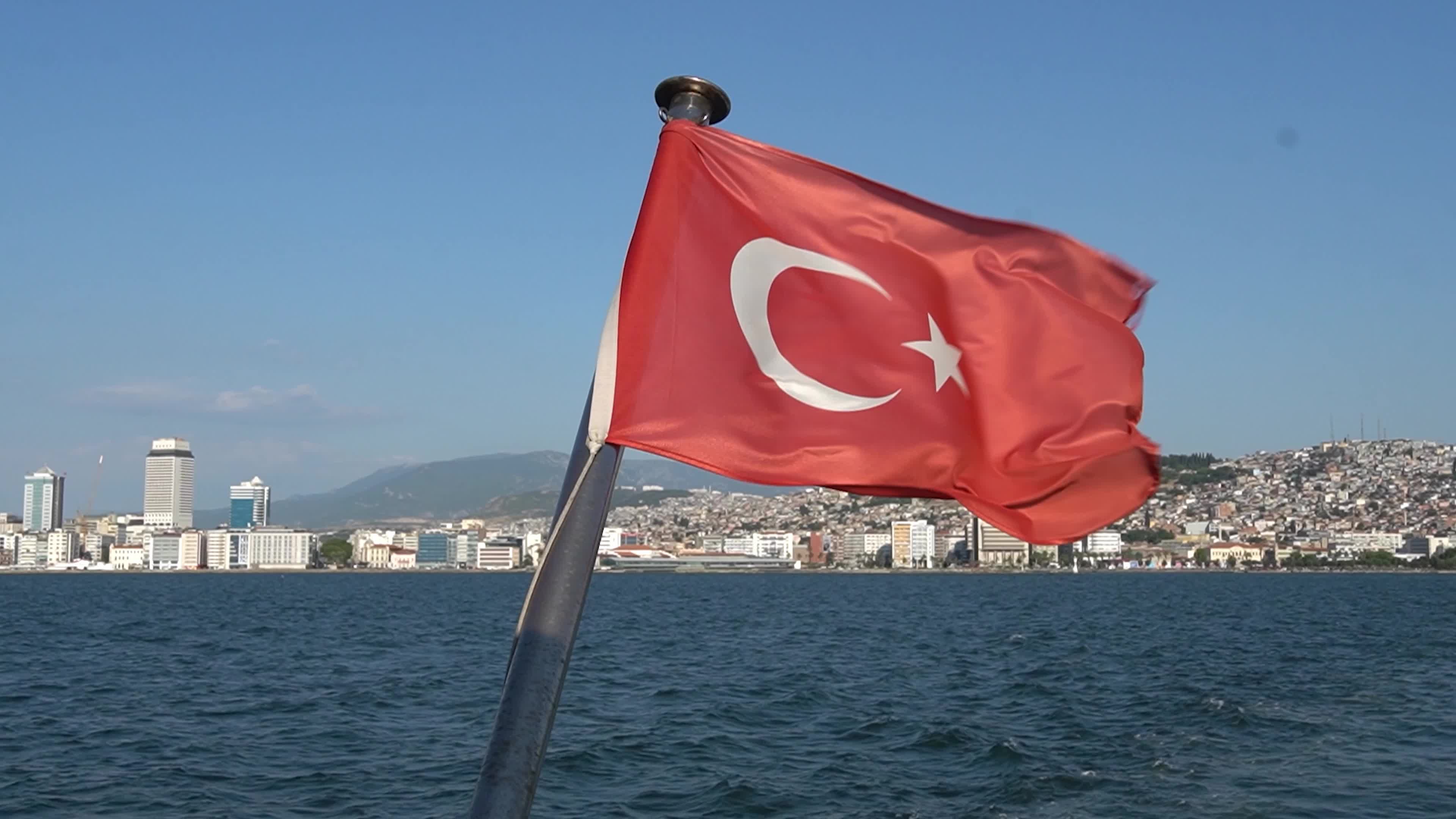 The Turkish national flag waving on a flagpole