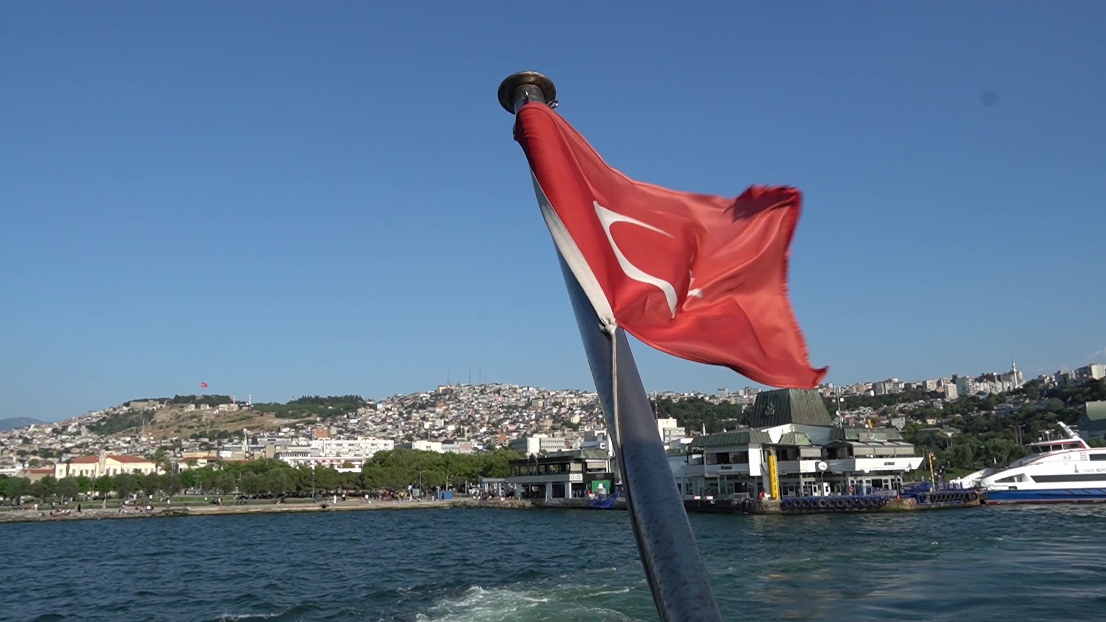 The Turkish national flag waving on a flagpole
