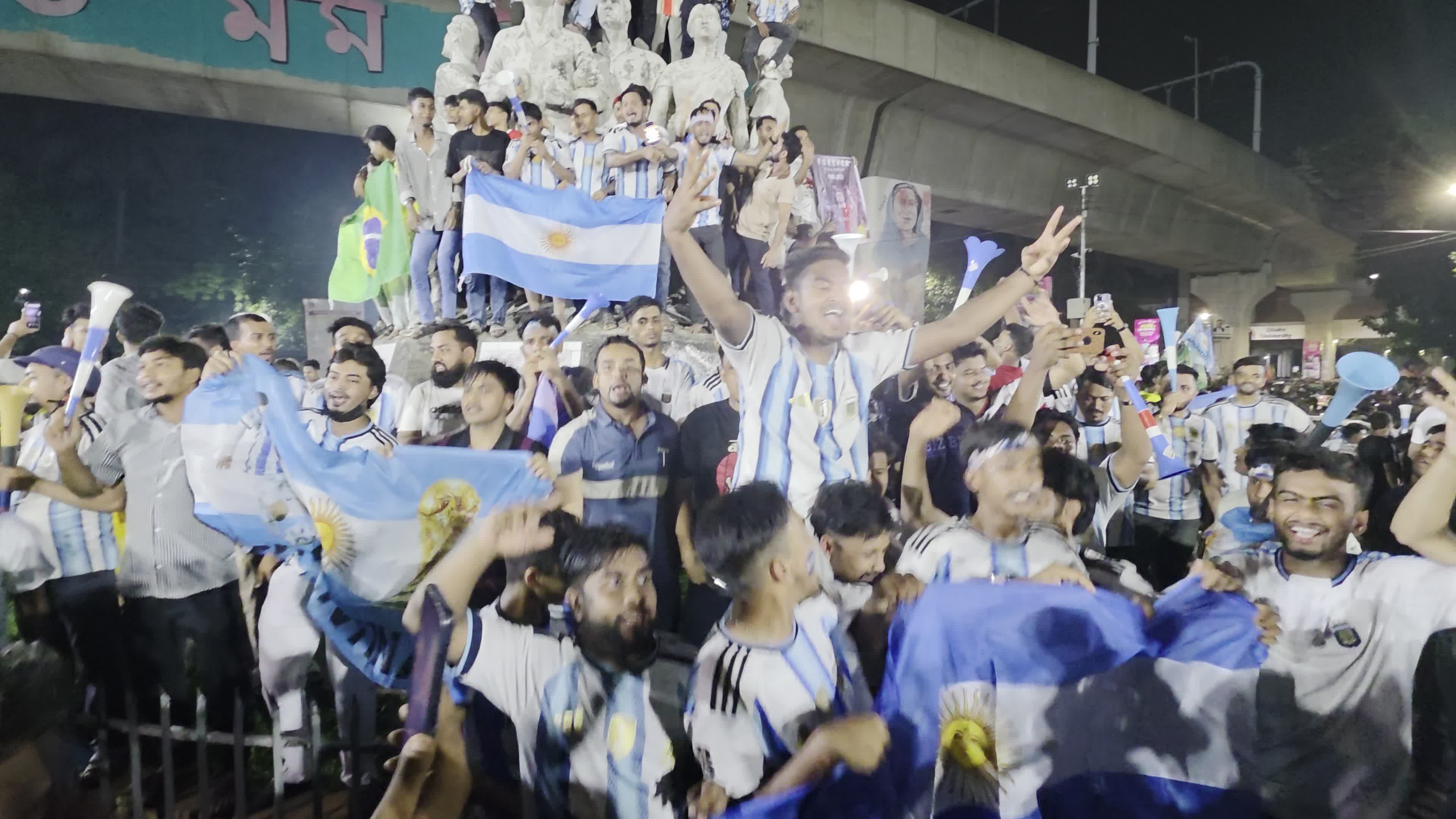 Football Fans Watch Argentina and Austria Football Match in Dhaka.