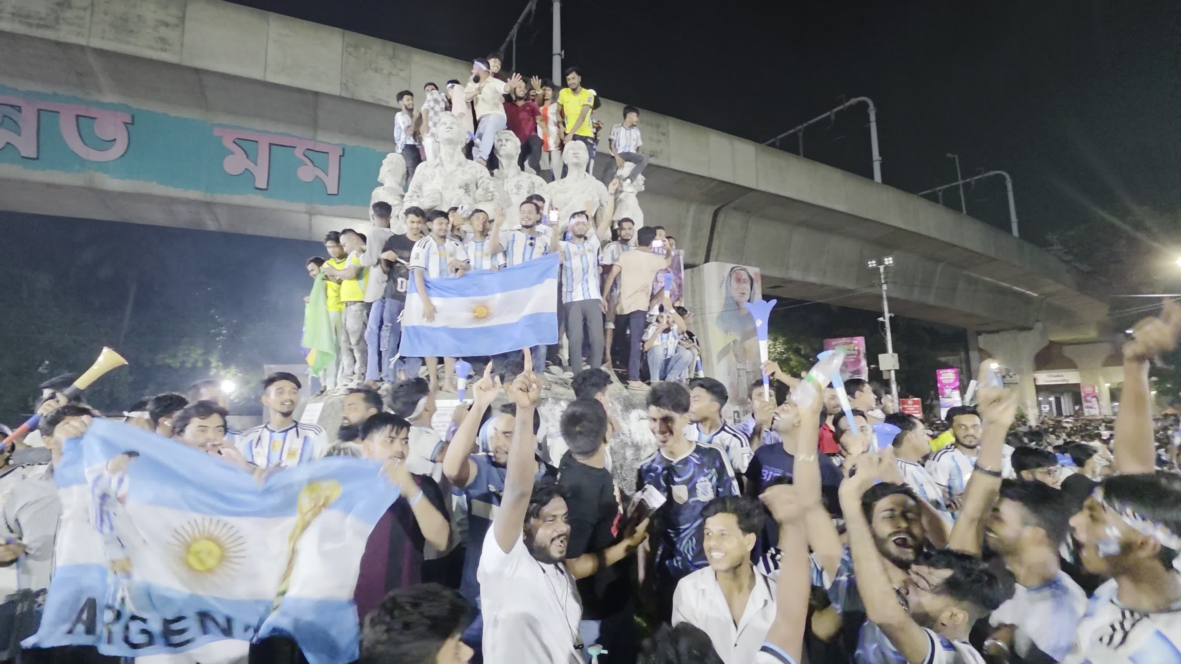Football Fans Watch Argentina and Austria Football Match in Dhaka.