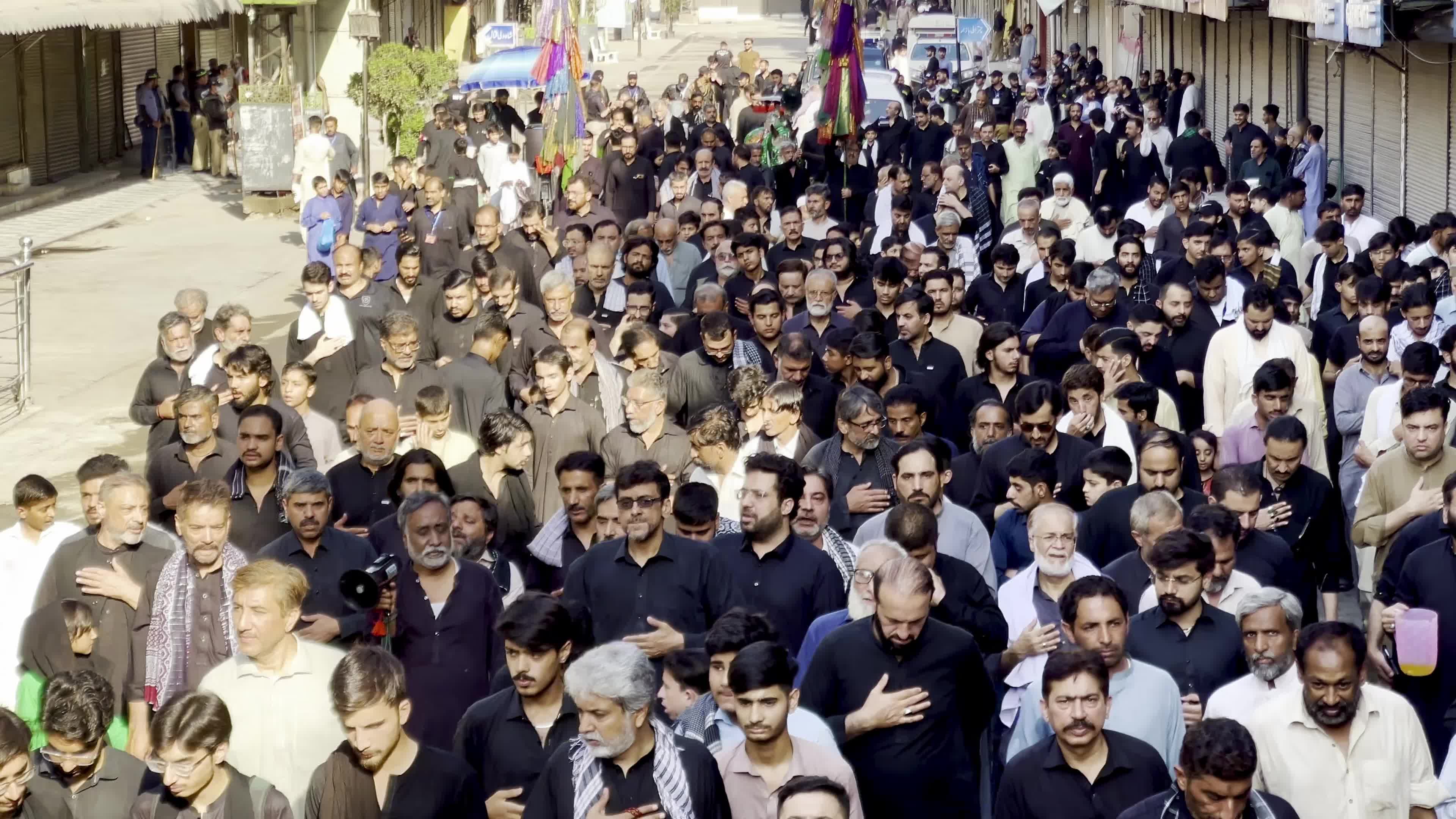Shiite Muslim Mourners Participate in Religious Procession to Honor Imam Hussain (A.S.) and Remember the Martyrs of Karbala