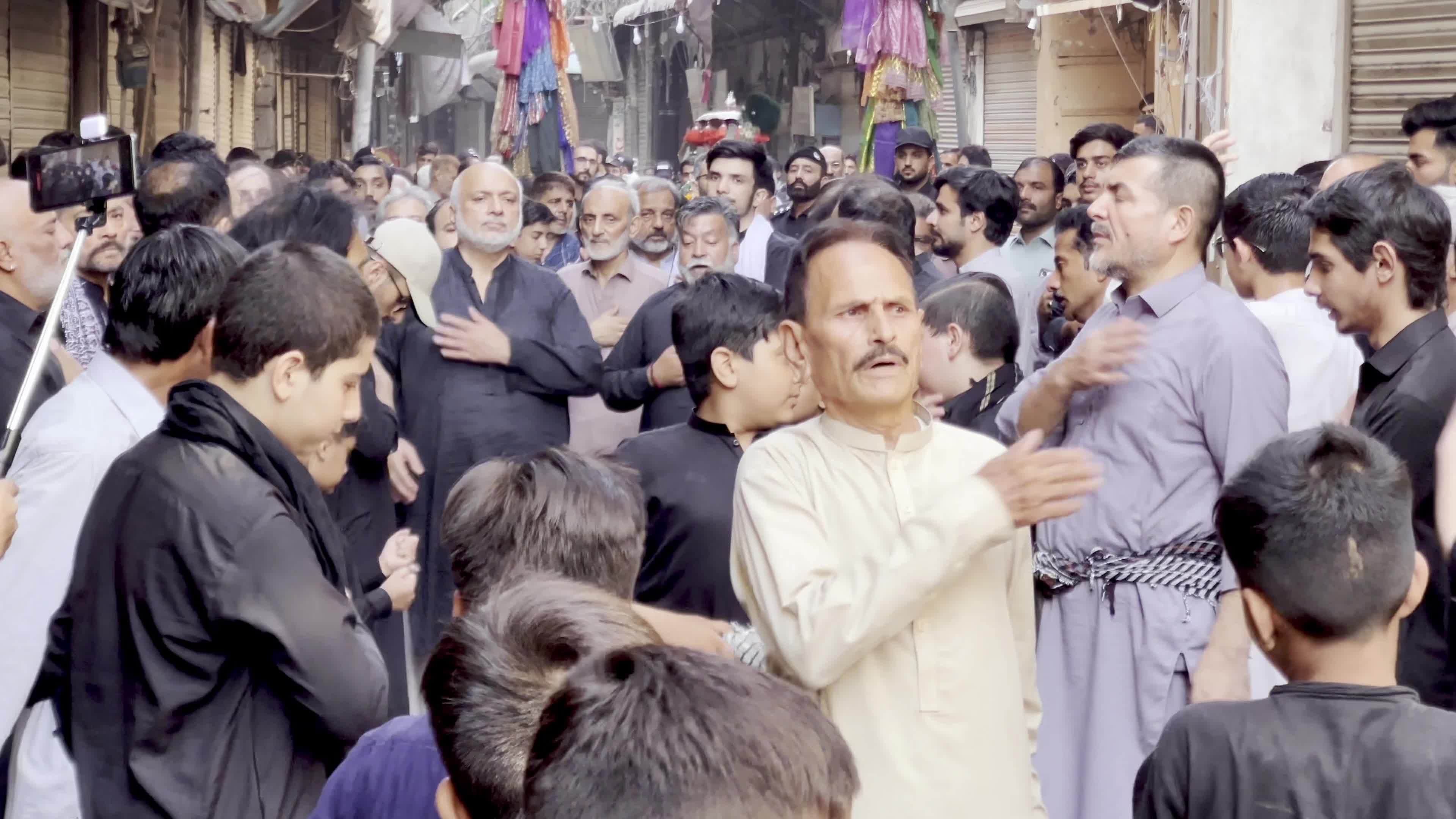 Shiite Muslim Mourners Participate in Religious Procession to Honor Imam Hussain (A.S.) and Remember the Martyrs of Karbala